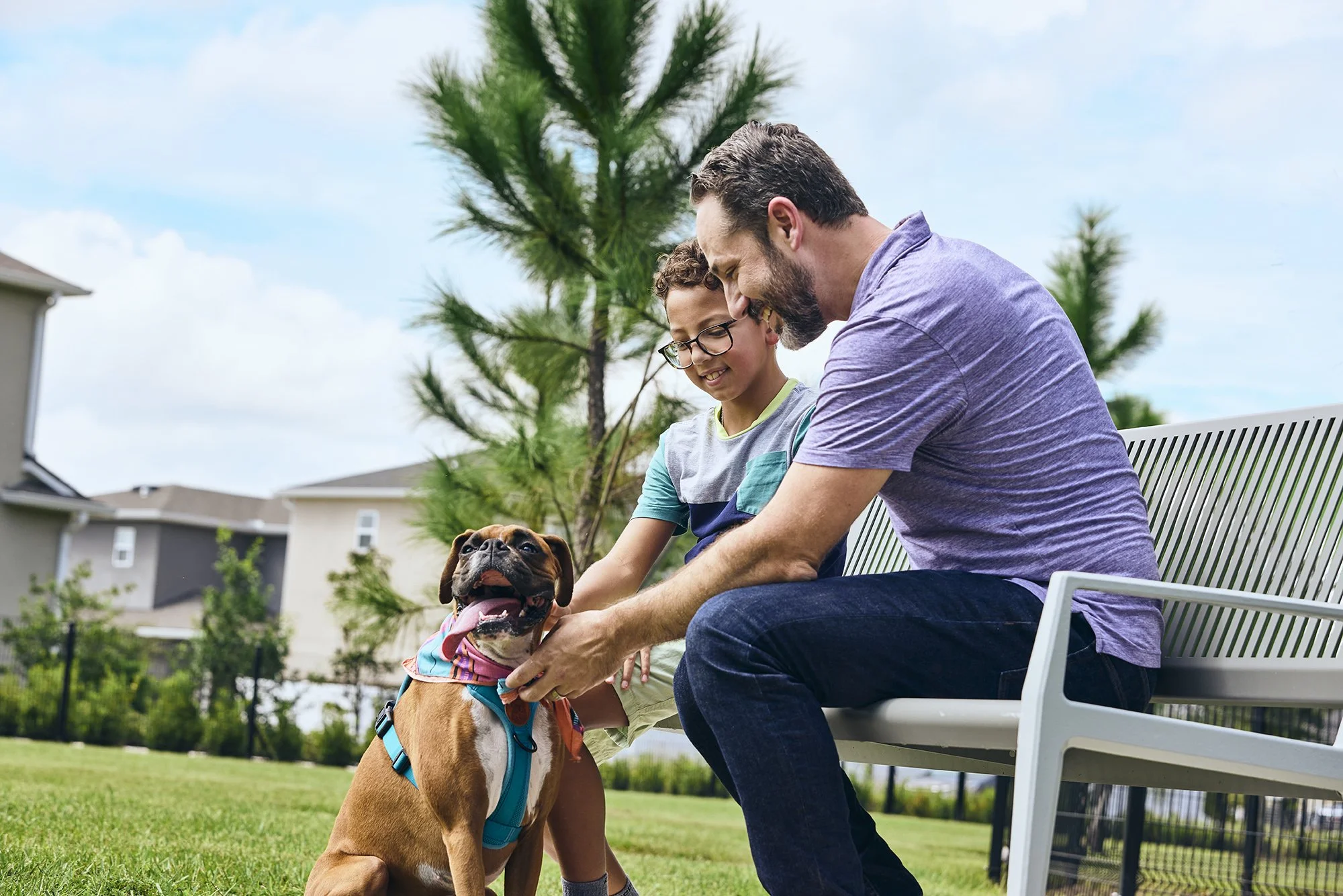 Lifestyle photo of a man and his dog at the Meridian Parks dog park in Orlando
