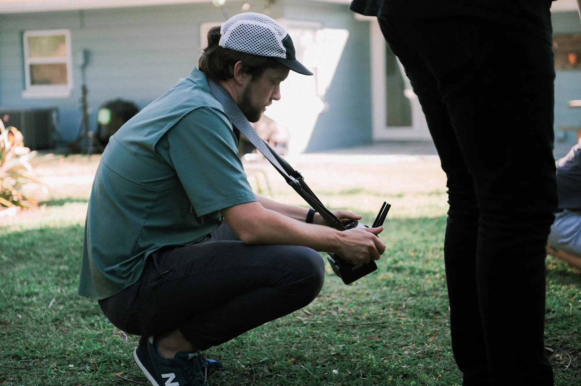 Director Brian Carlson sets up a wireless video transmitter on a Central Florida healthcare photo shoot location