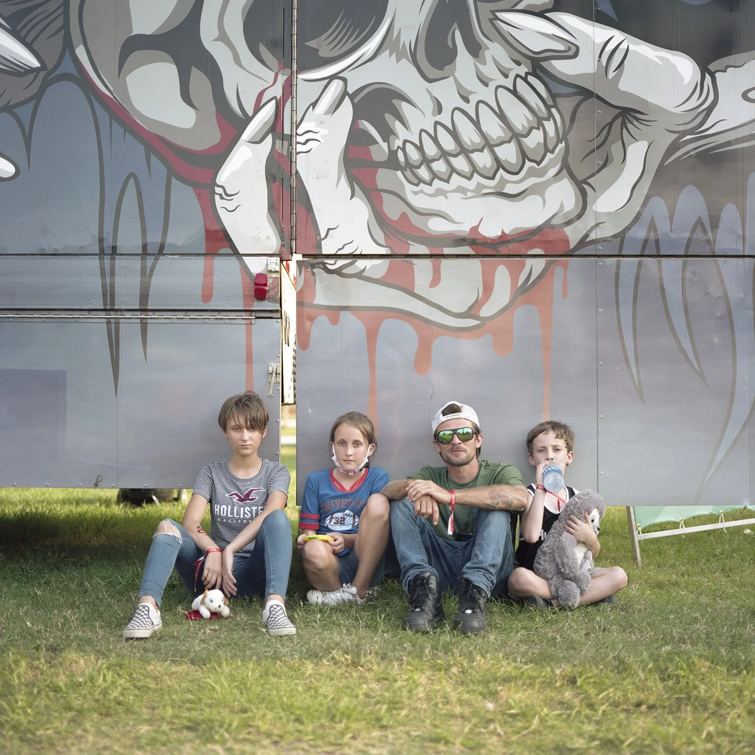 photograph of sitting family at carnival