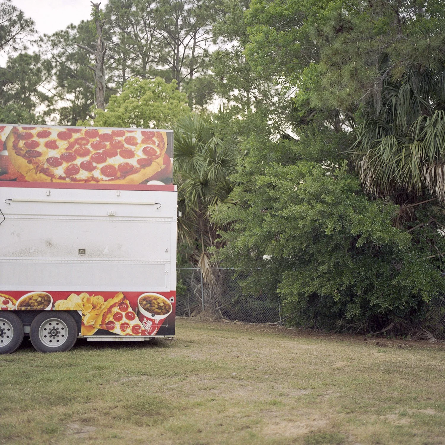 photograph of pizza truck at carnival