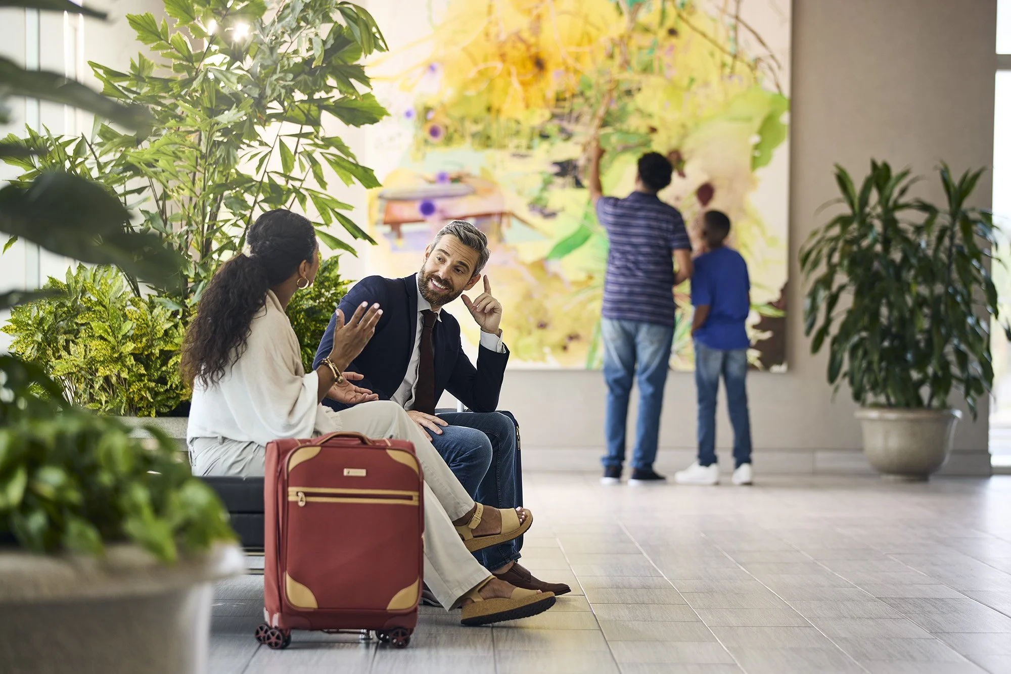 couple talking on bench at tampa international airport