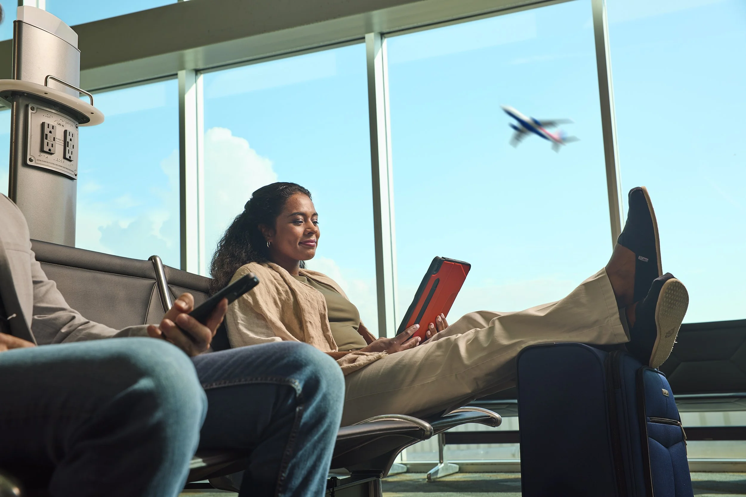 woman on ipad at terminal at tampa international airport