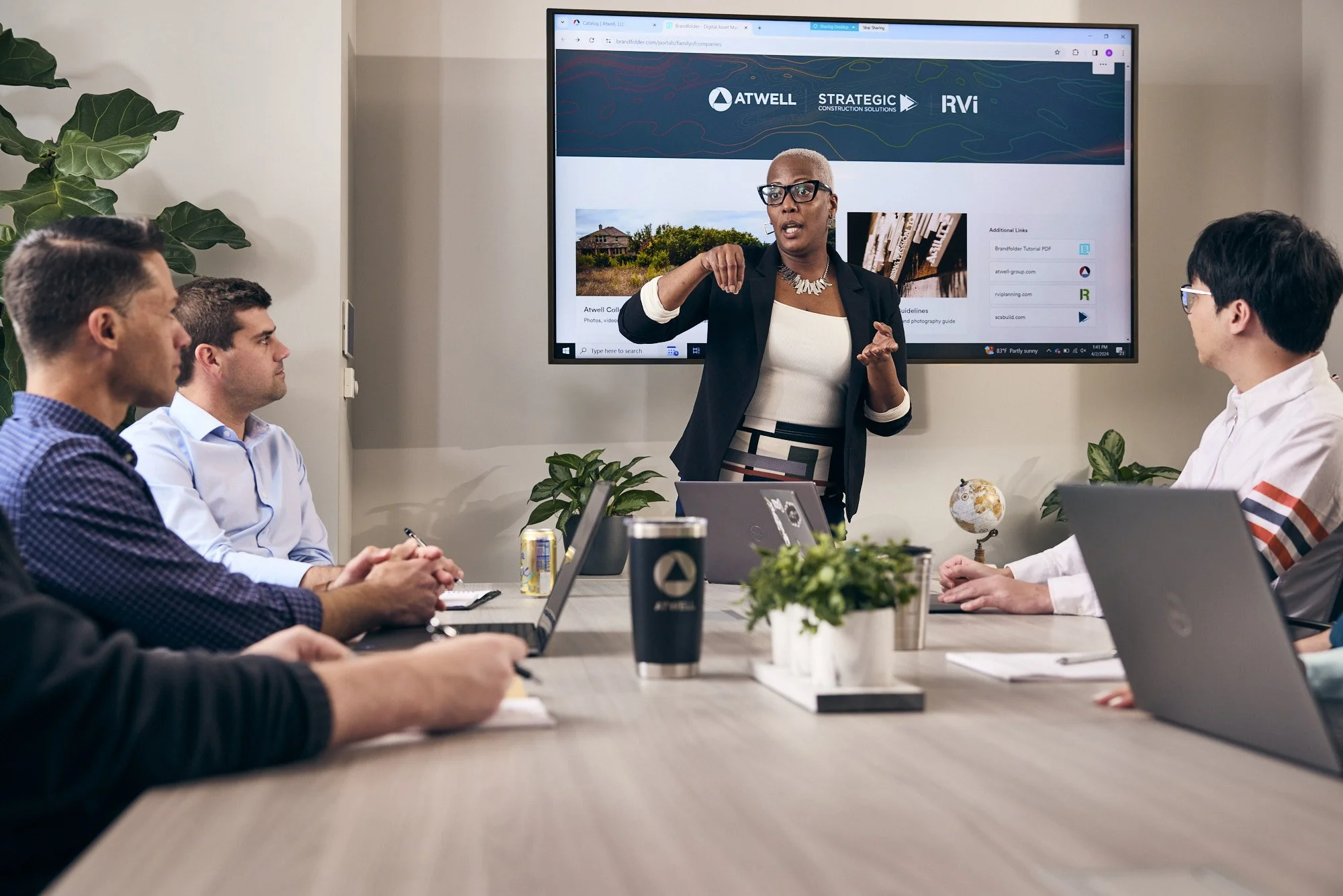 photograph of african american woman leading board meeting