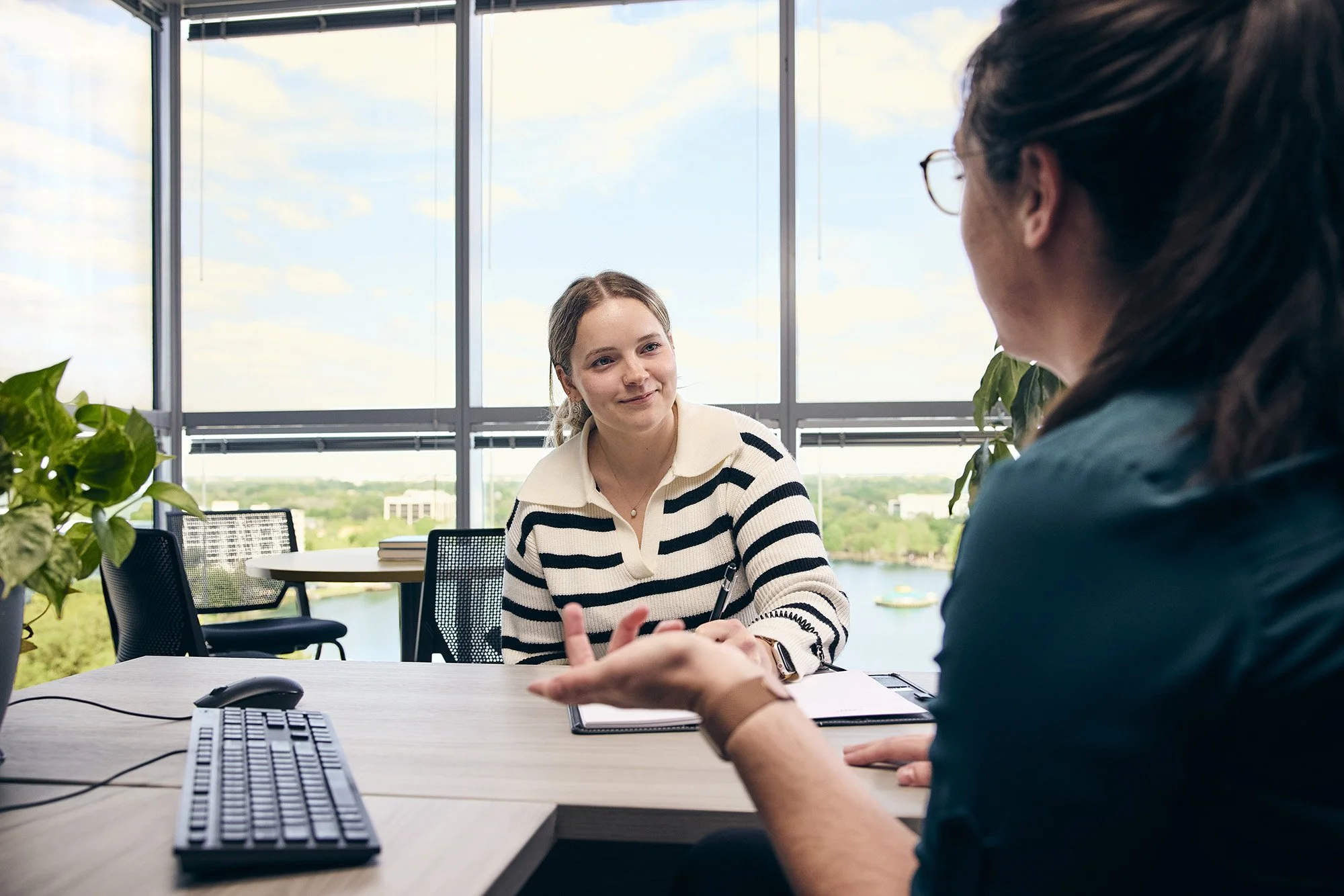 photograph of two women having a meeting
