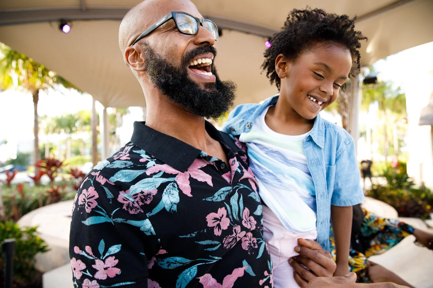 photograph of father dancing with son