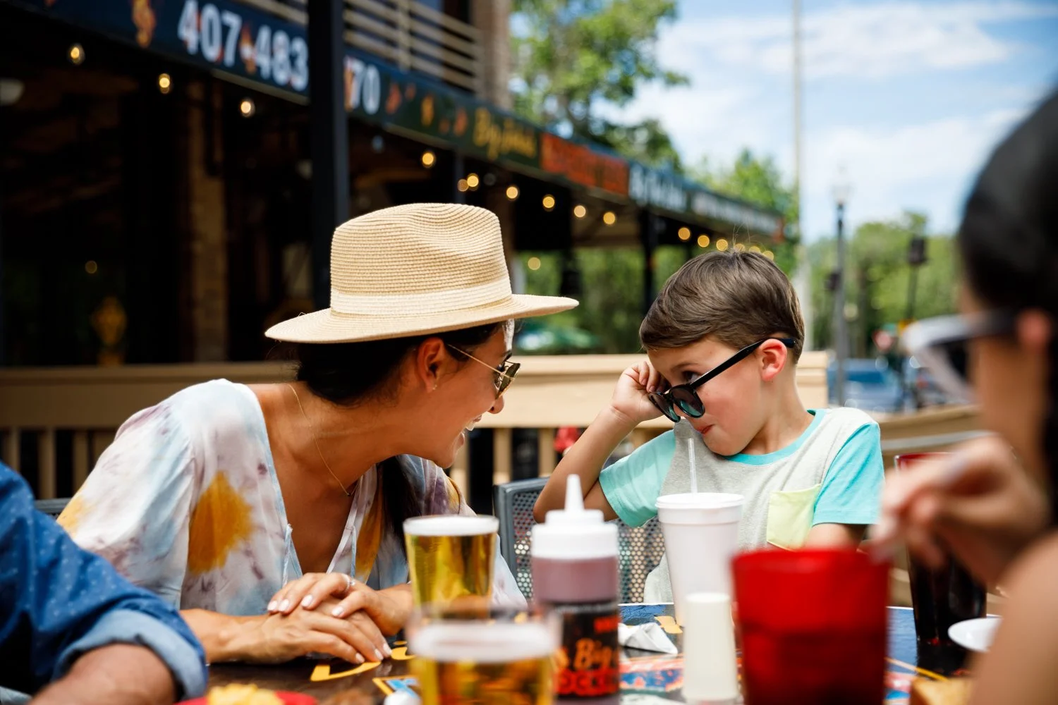 mother paying with son at restaurant