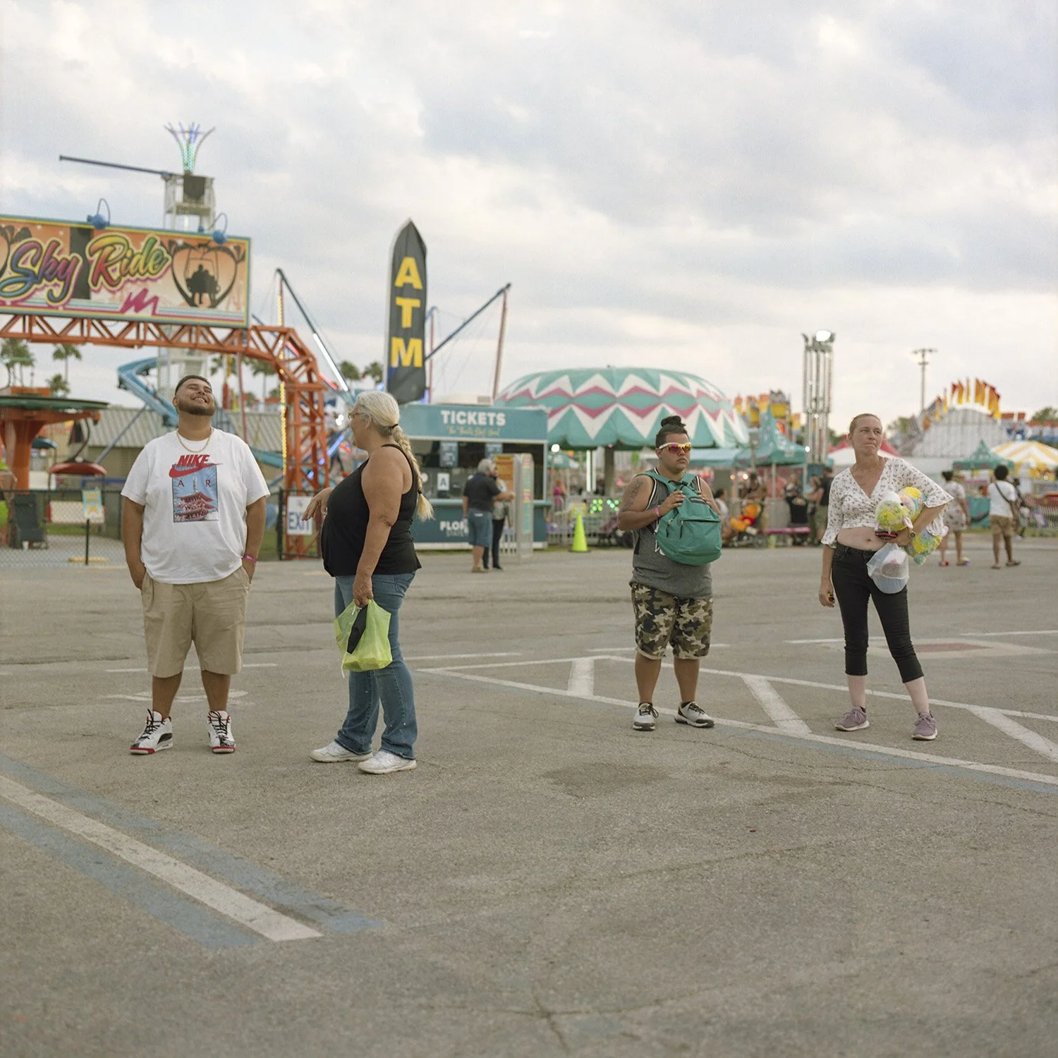 photograph of group of people at carnival