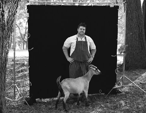 photograph of chef tony adams with a goat