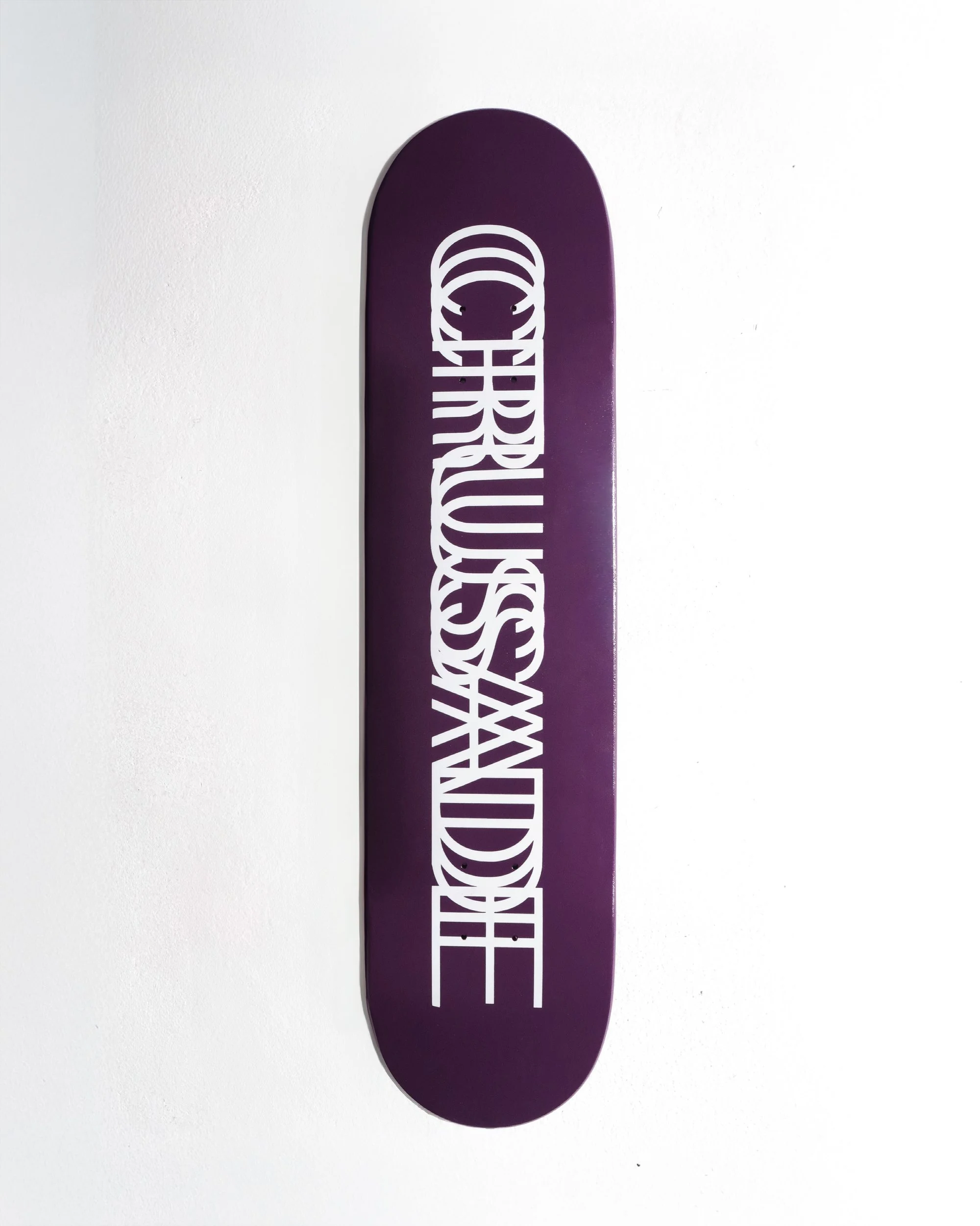 Purple+Motion+Logo+Skateboard+Flat+Lay.png