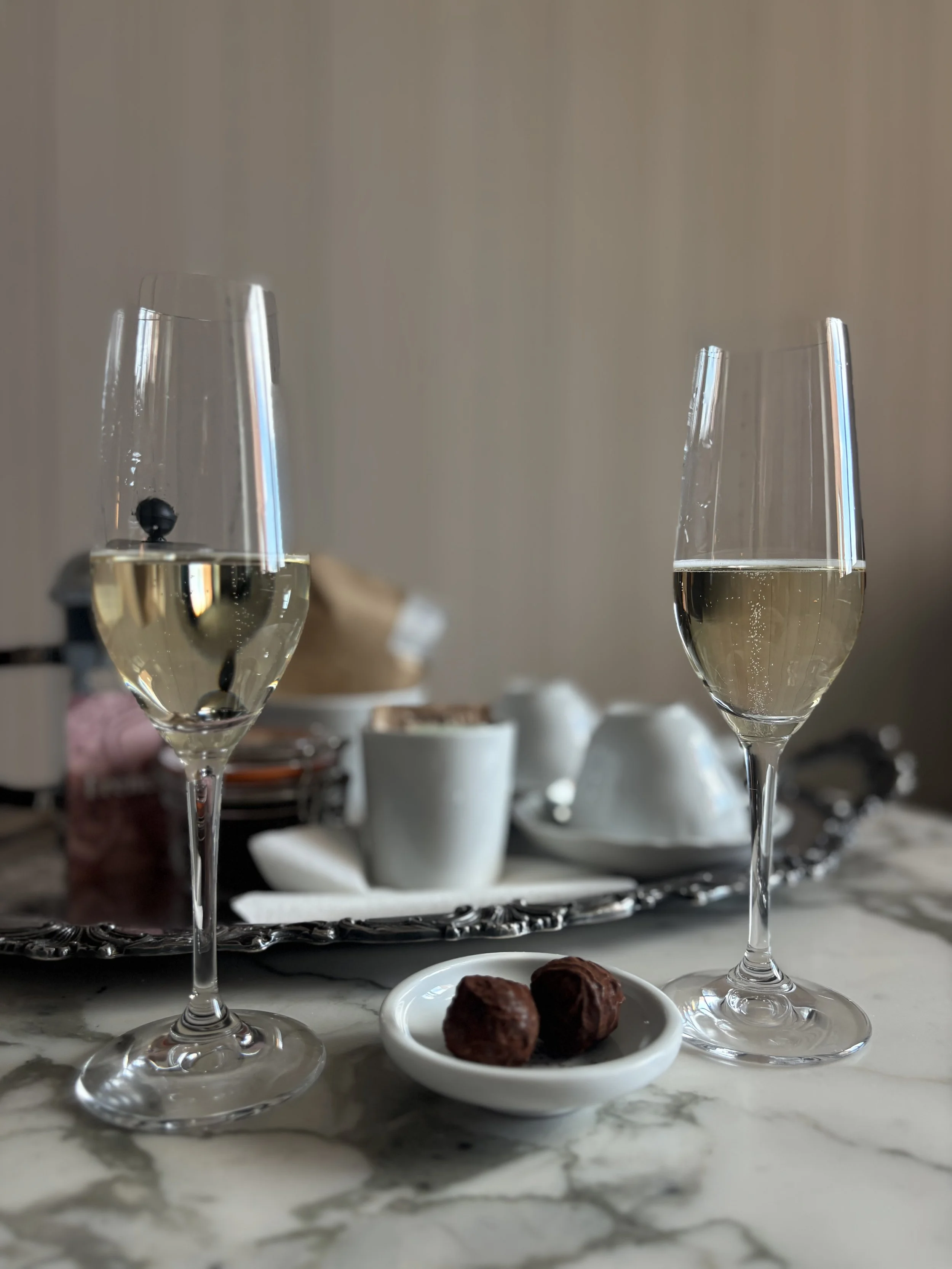 Two champagne glasses with chocolate truffles at The Royal Hotel