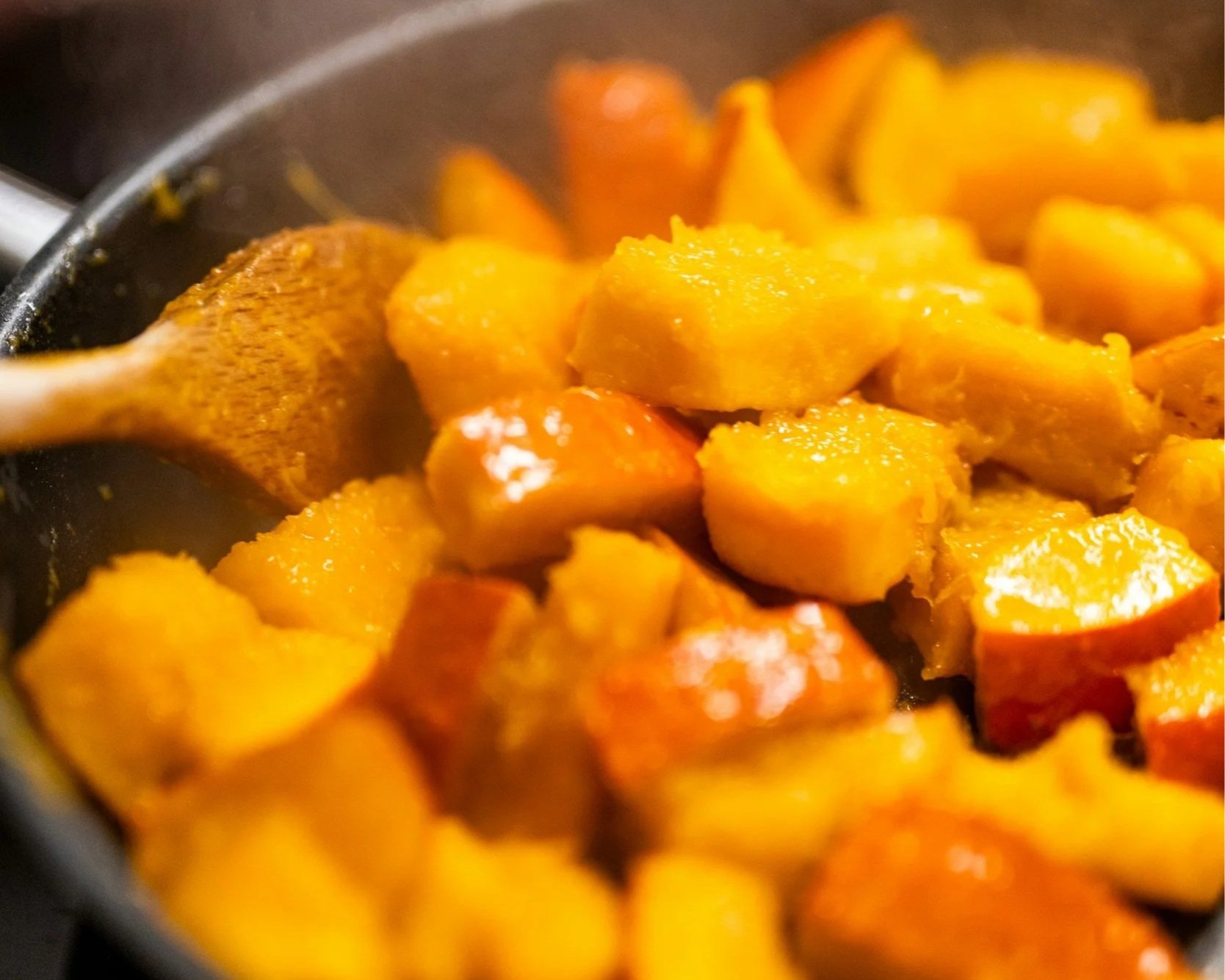 a pan of cooked squash and sweet potatoes