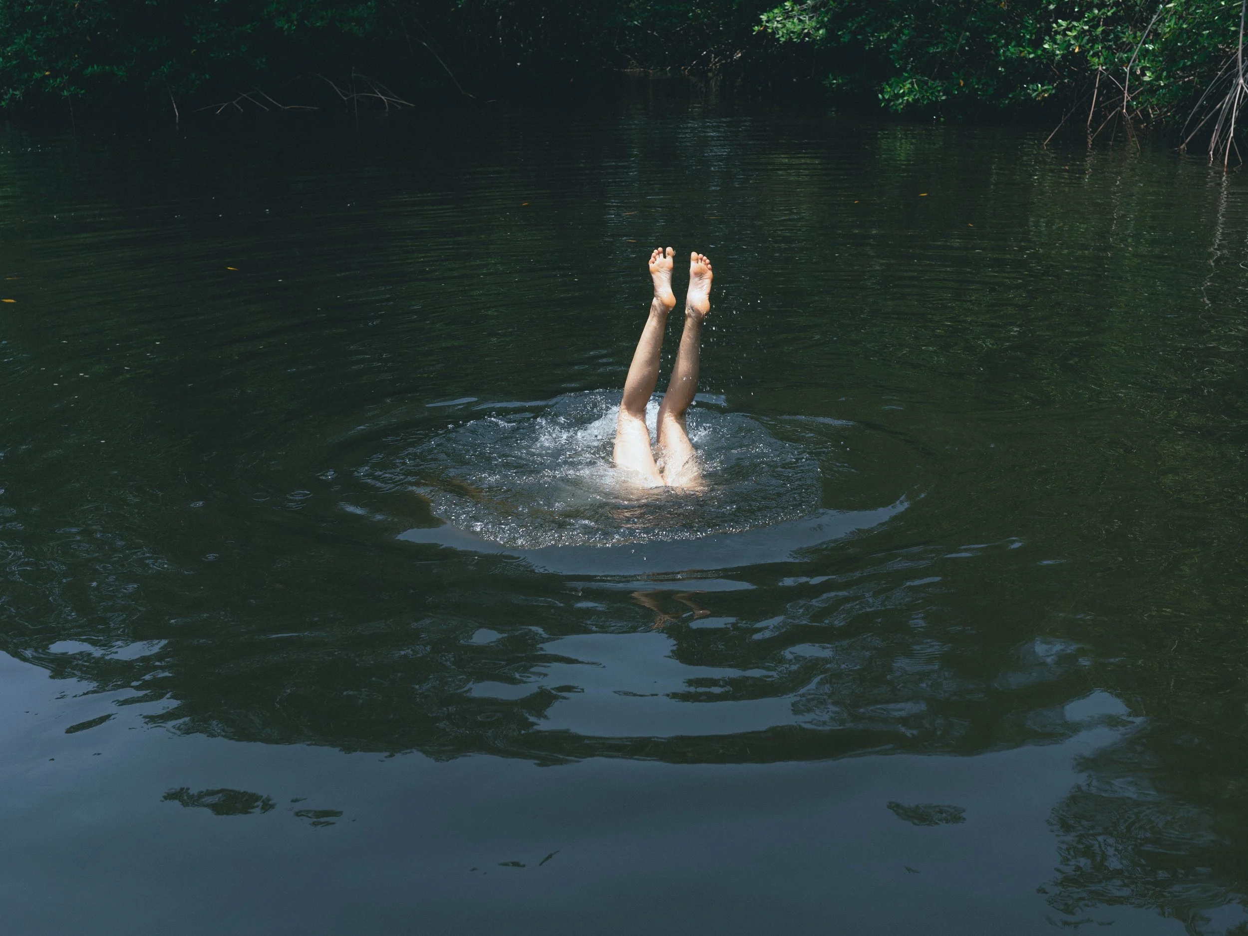 Retreat guest swimming in the mangroves during a boat tour in Nicaragua