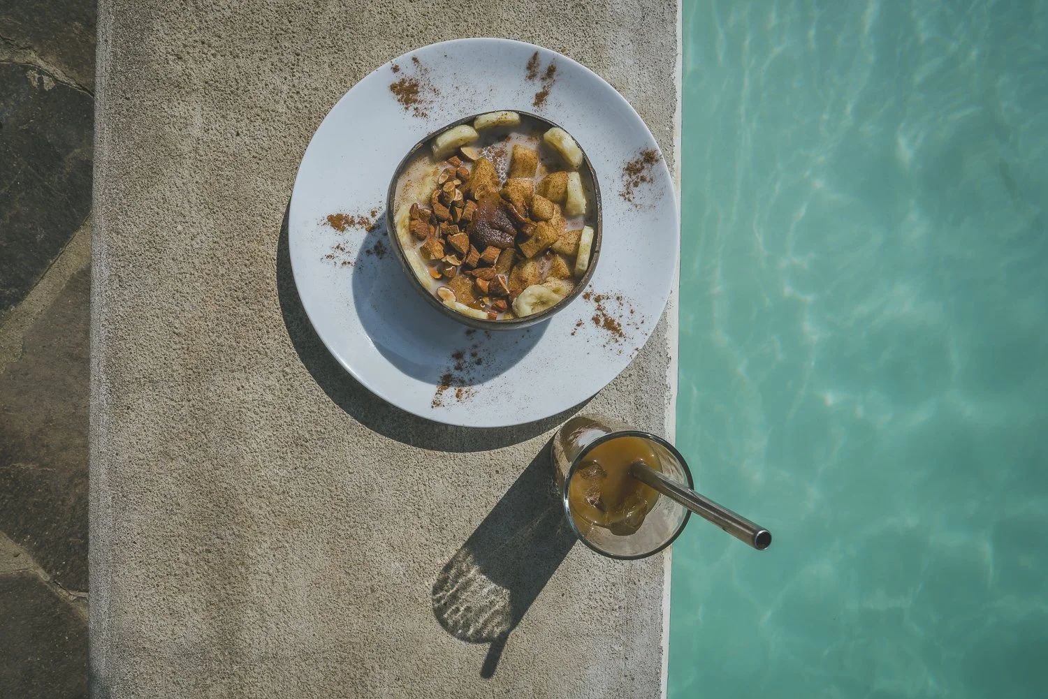 Farm-fresh smoothie bowl served poolside at a yoga retreat venue in Nicaragua