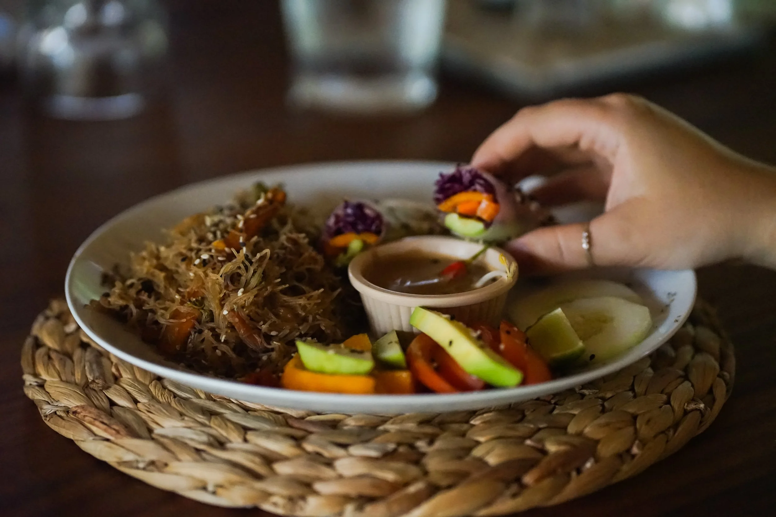 Farm-to-table rice noodle plate with fresh vegetables and dipping sauce at Still Salty Escape surf and yoga retreat in Nicaragua
