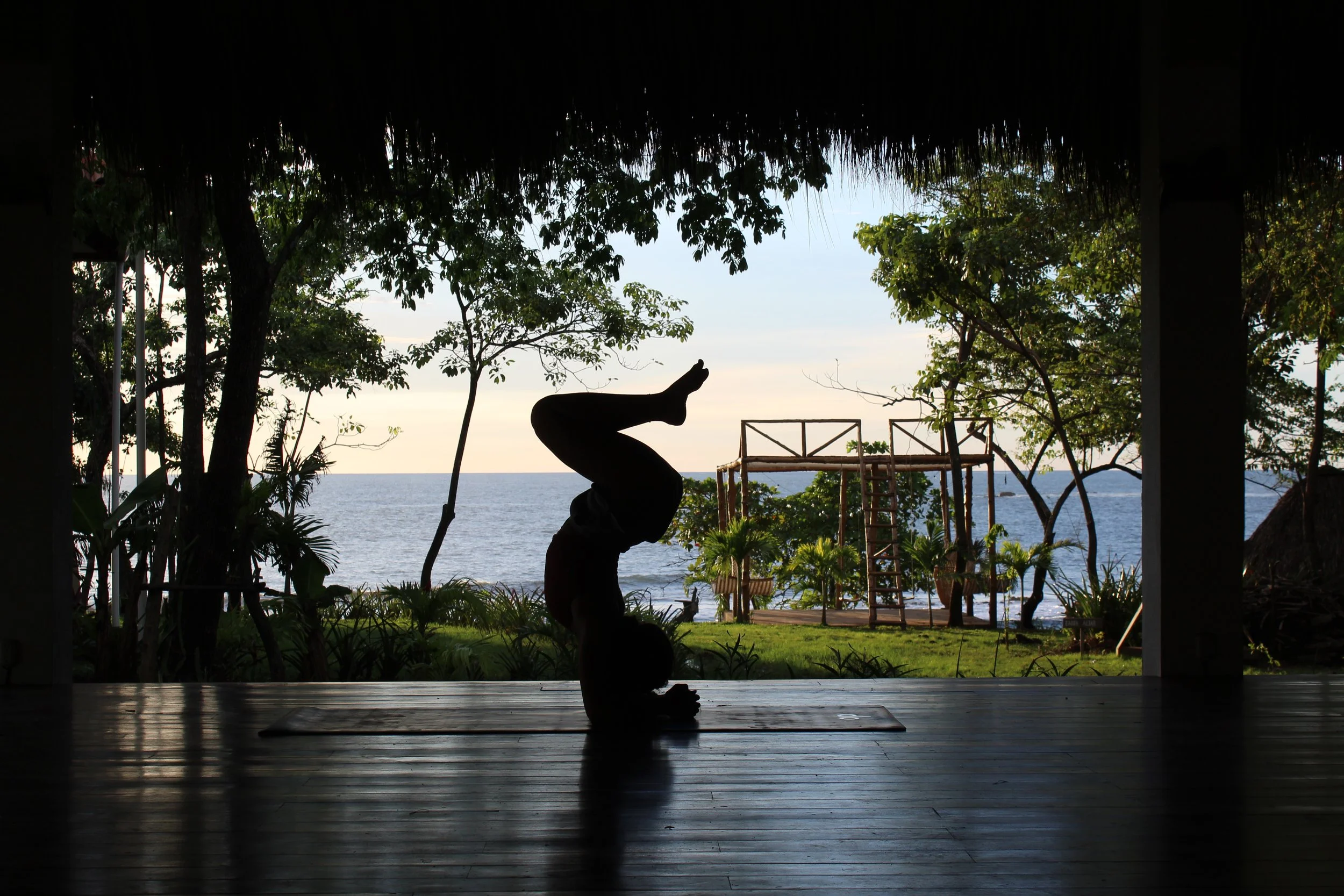 Surfer practicing yoga near the ocean in Northern Nicaragua