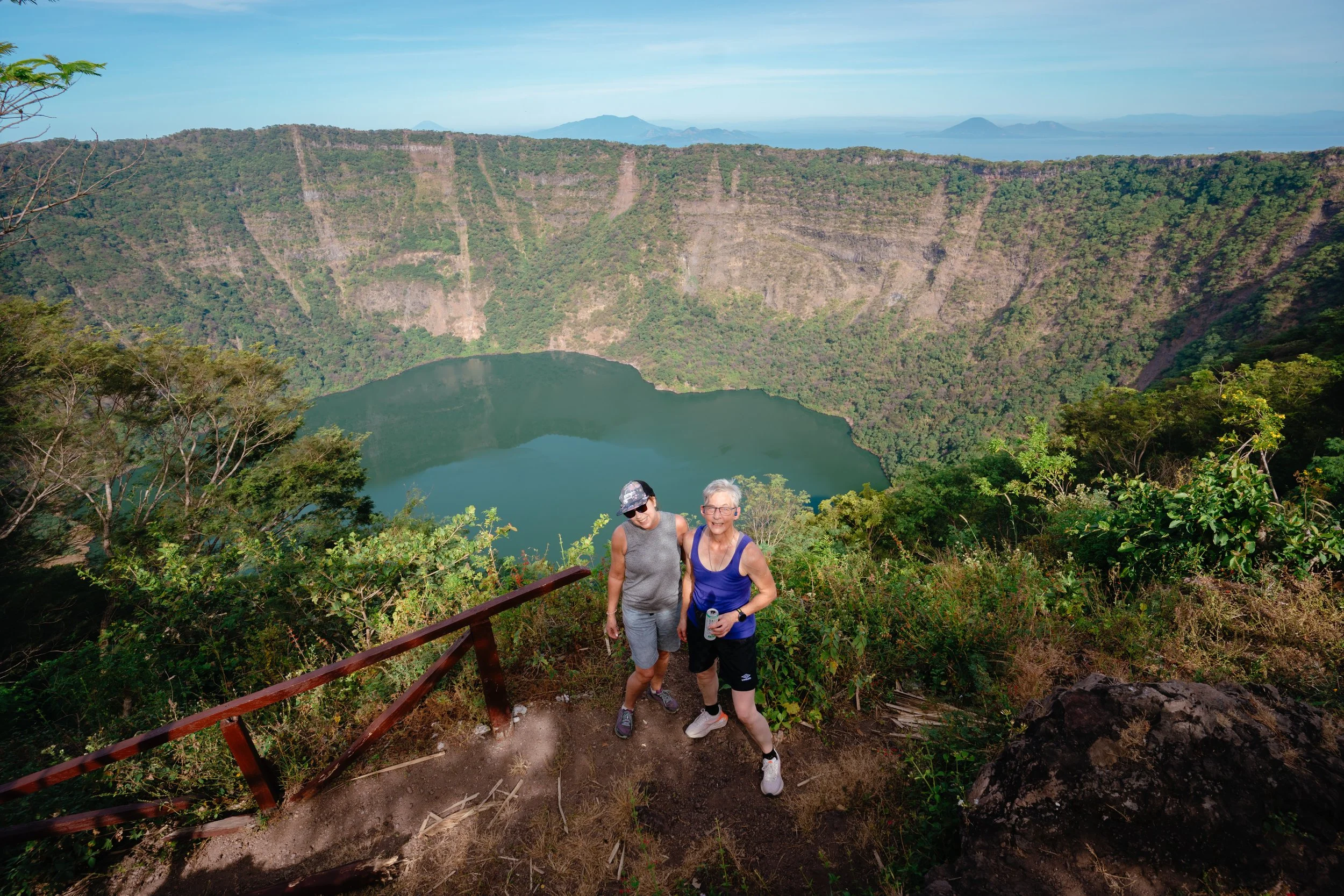 Two guests at the Cosigüina crater lake overlook after a volcano hike in northern Nicaragua