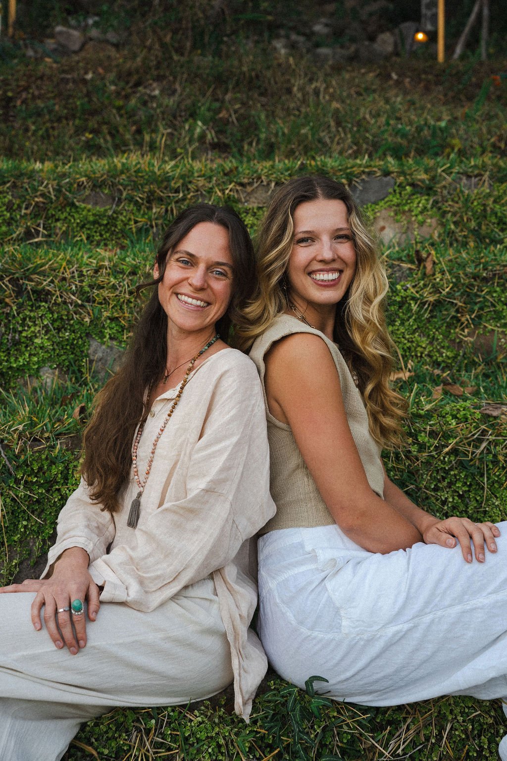 Yoga teachers Lydia and Esme of Embodied Being Retreats smiling together at sunset on retreat in Nicaragua