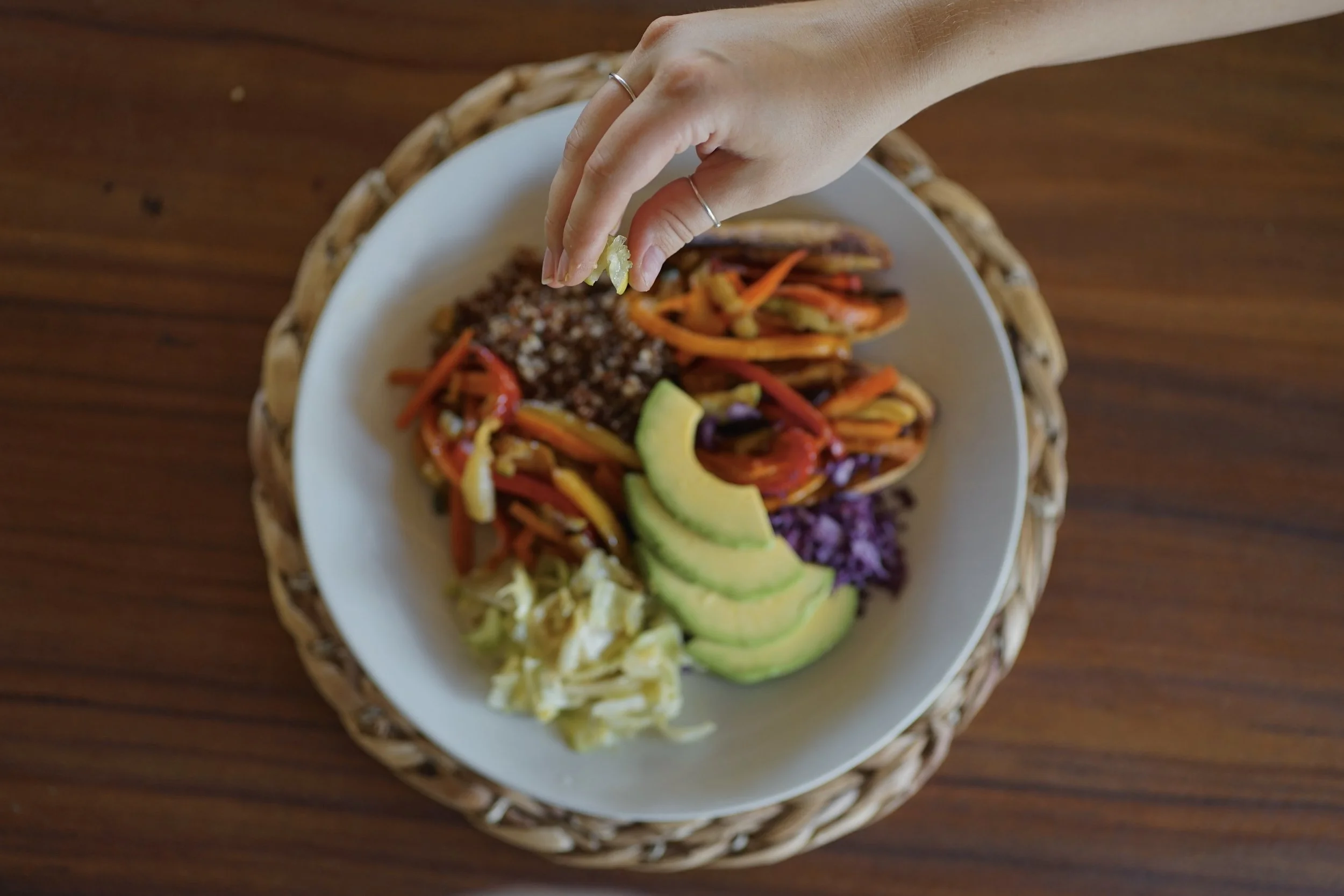 Colorful farm-fresh bowl of quinoa, avocado, peppers, and vegetables at an organic retreat in Nicaragua