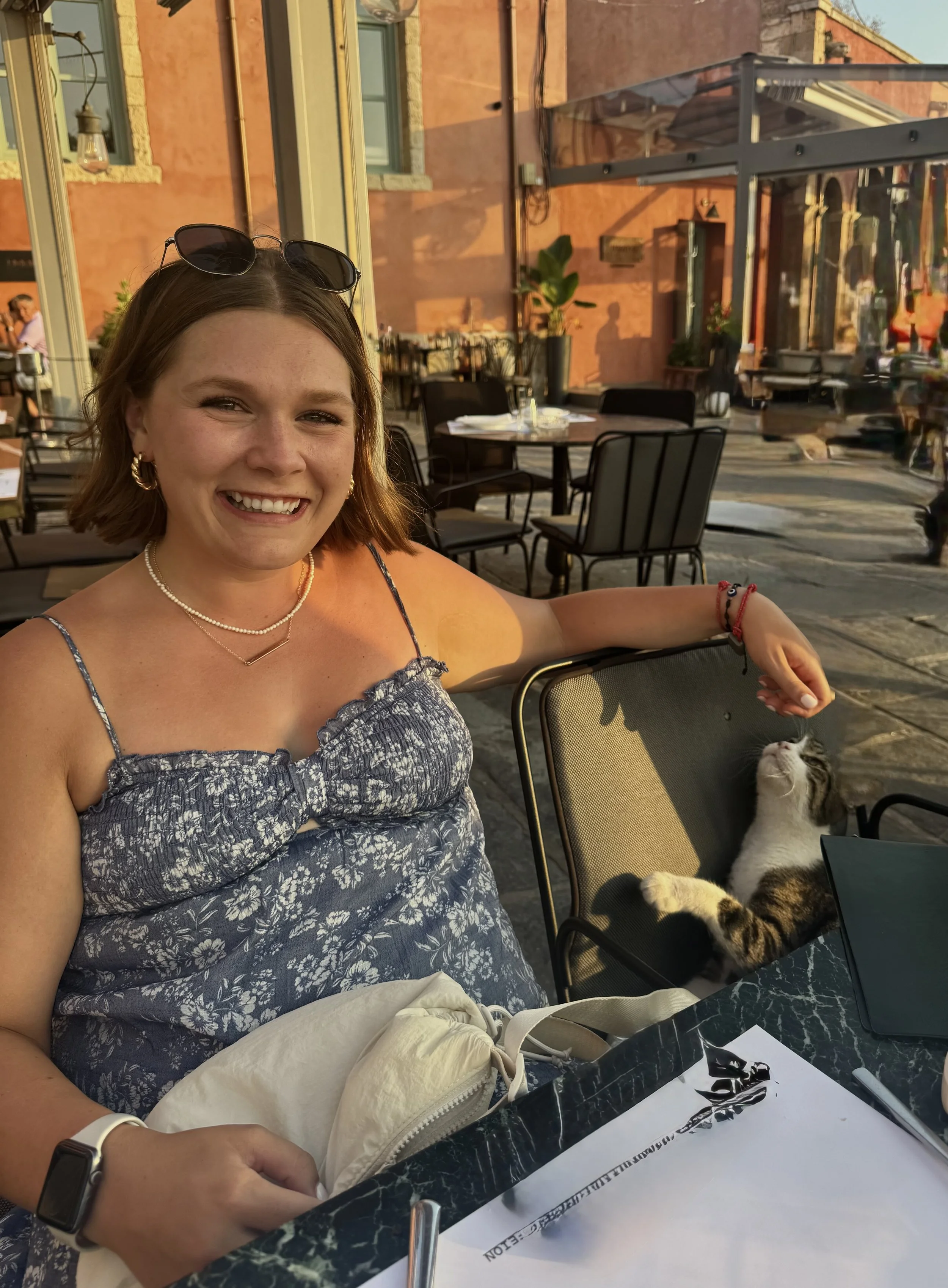 Dr. Nicole Tibbits spending time with her tuxedo cat, Zuki