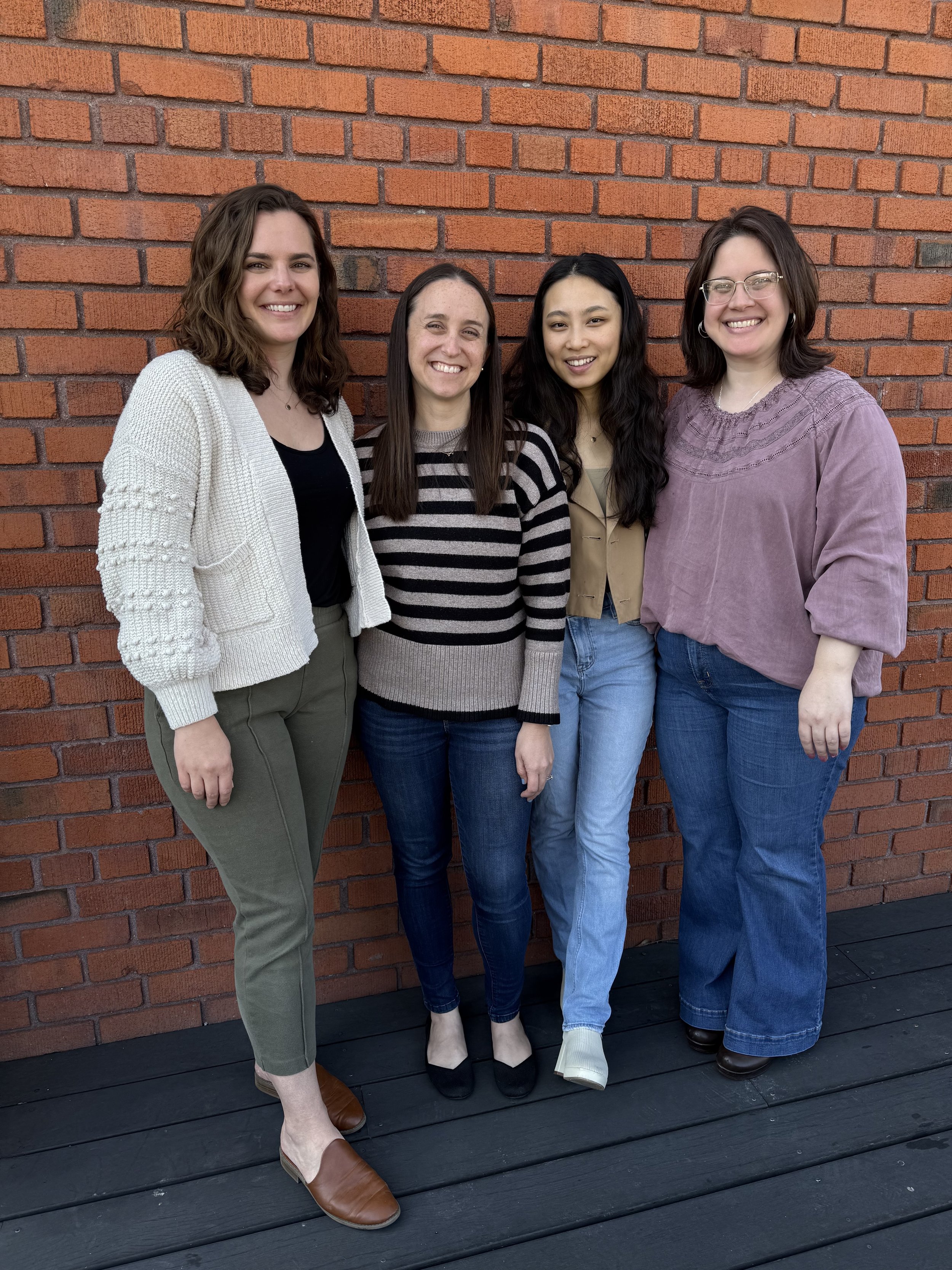 Four CPC Therapists are standing side-by-side each other and smiling