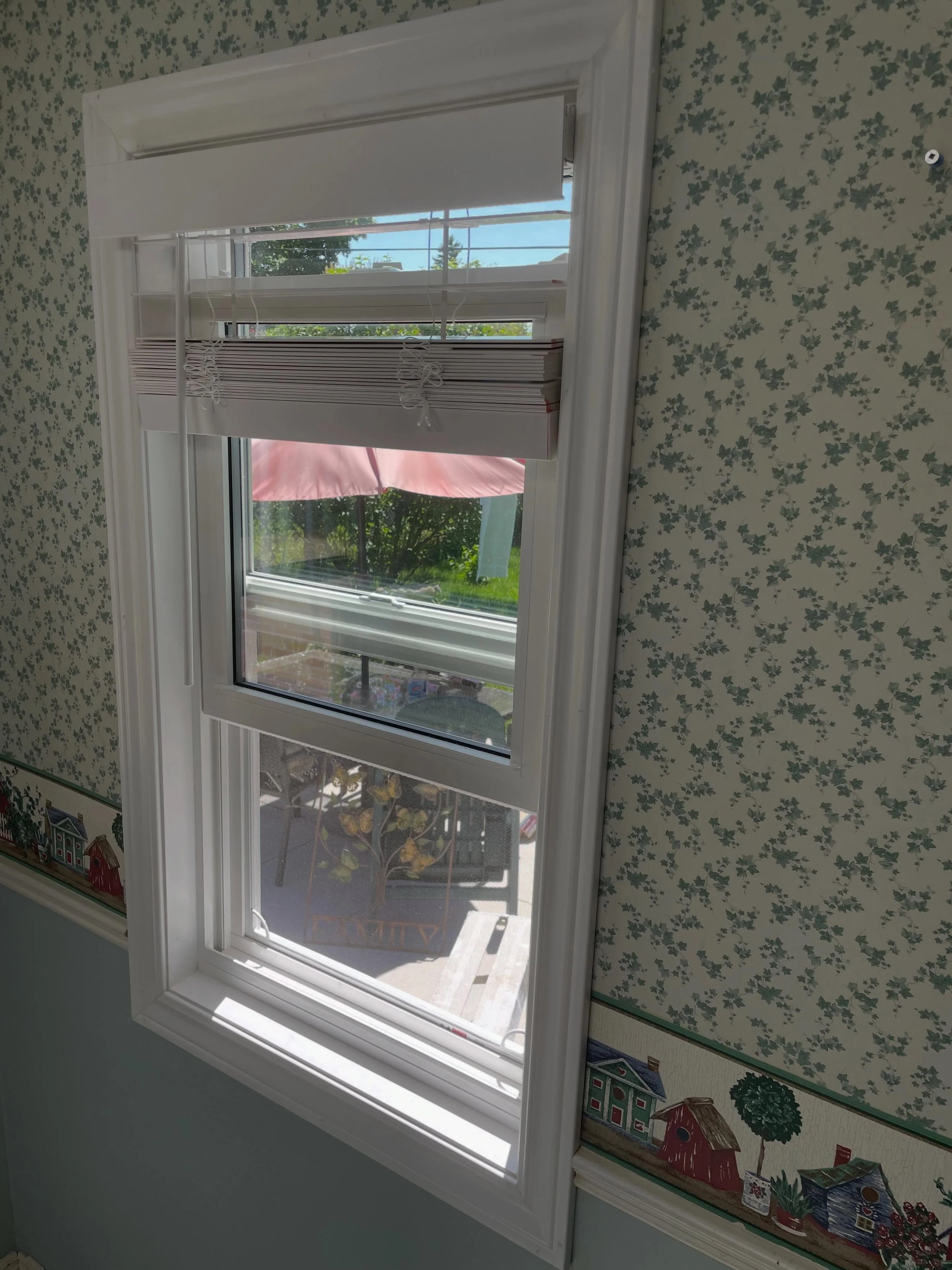 Goodbye old wood frame windows, hello bright new vinyl