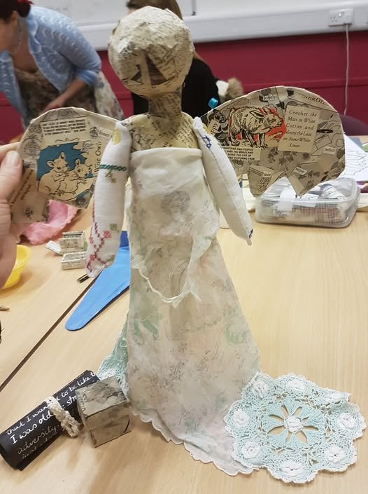 photograph of my completed angel and accompanying paper scroll, before her headscarf is added
