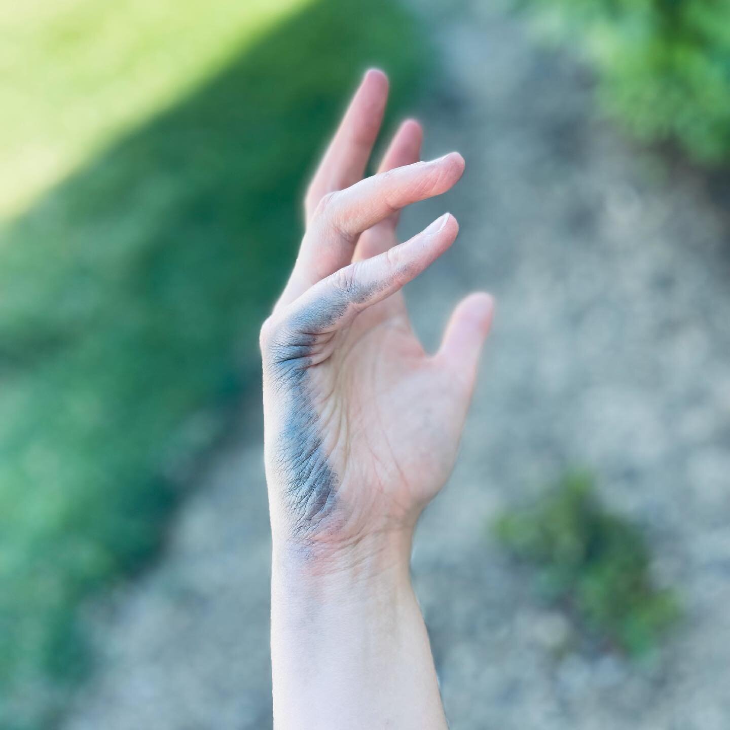 Hand covered in graphite &mdash; the sign of a perfect hour spent drawing in the summer shade.