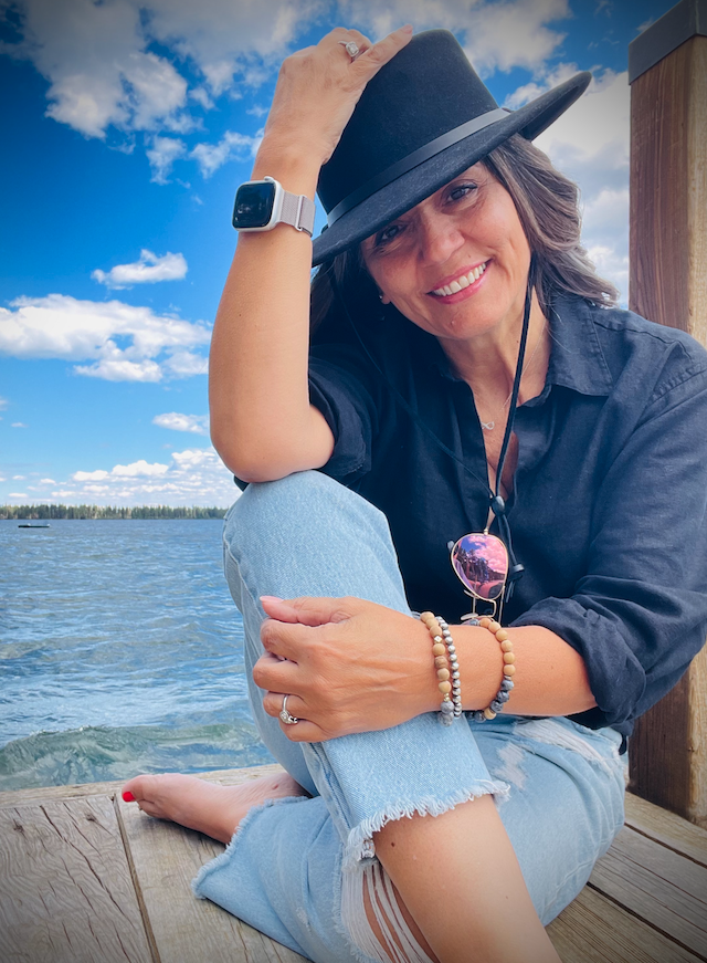 Fatima at lake black hat self portrait.png