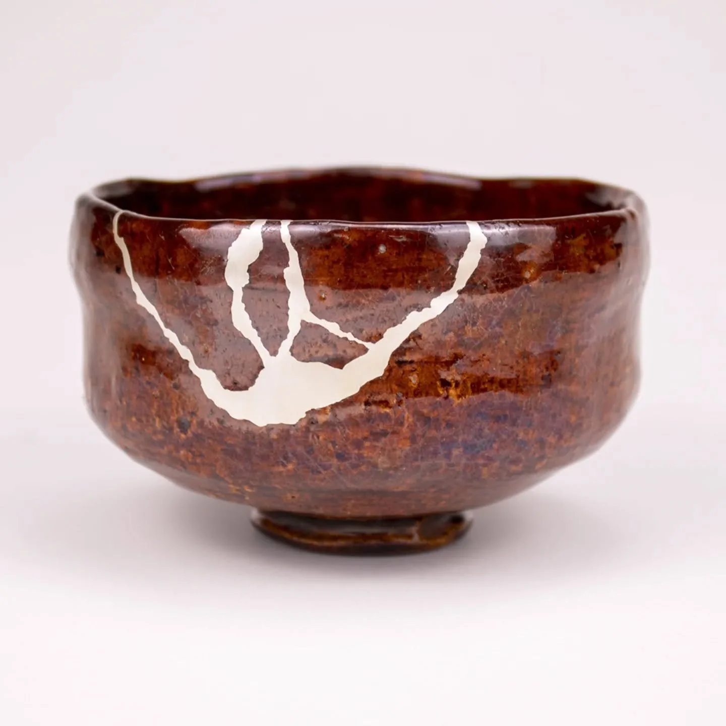 Beautiful Ohi raku matcha bowl. We were honored to repair it. We were invited to the tea ceremony and had tasty matcha with this tea bowl we repaired. It was an absolute amazing experience. We thank our client and the tea master who welcomed us for t