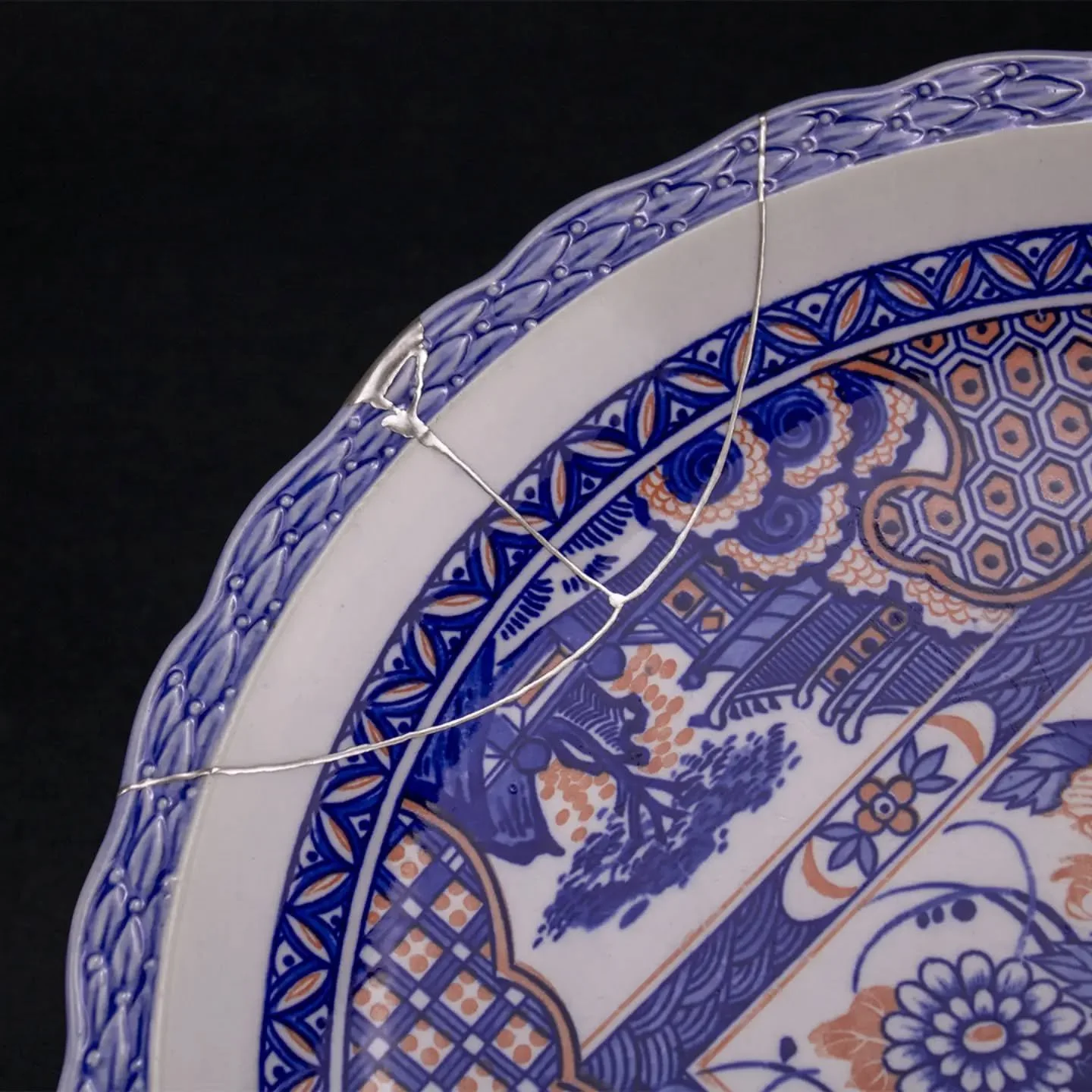 Gintsugi. Gin means silver, tsugi means joint in Japanese. Beautiful 13 inch plate with silver finish.  It's difficult, but fun to sculpt the missing areas.