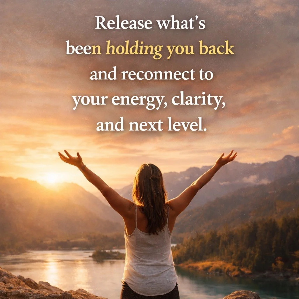 A woman standing outdoors with her arms raised, overlooking a river and mountains during a sunset, with an inspirational quote about releasing what holds you back and reconnecting to your energy and clarity.