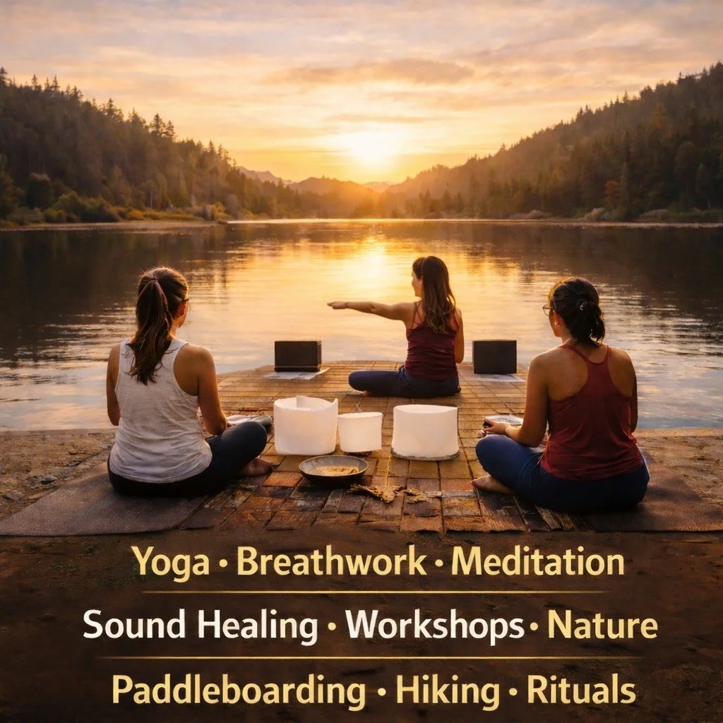 Three women practicing yoga and meditation on wooden dock by a river during sunset, with mountains and trees in the background. Items include yoga mats, bowls, and laptops. Text overlay lists activities like yoga, breathwork, meditation, sound healing, workshops, nature, paddleboarding, hiking, and rituals.