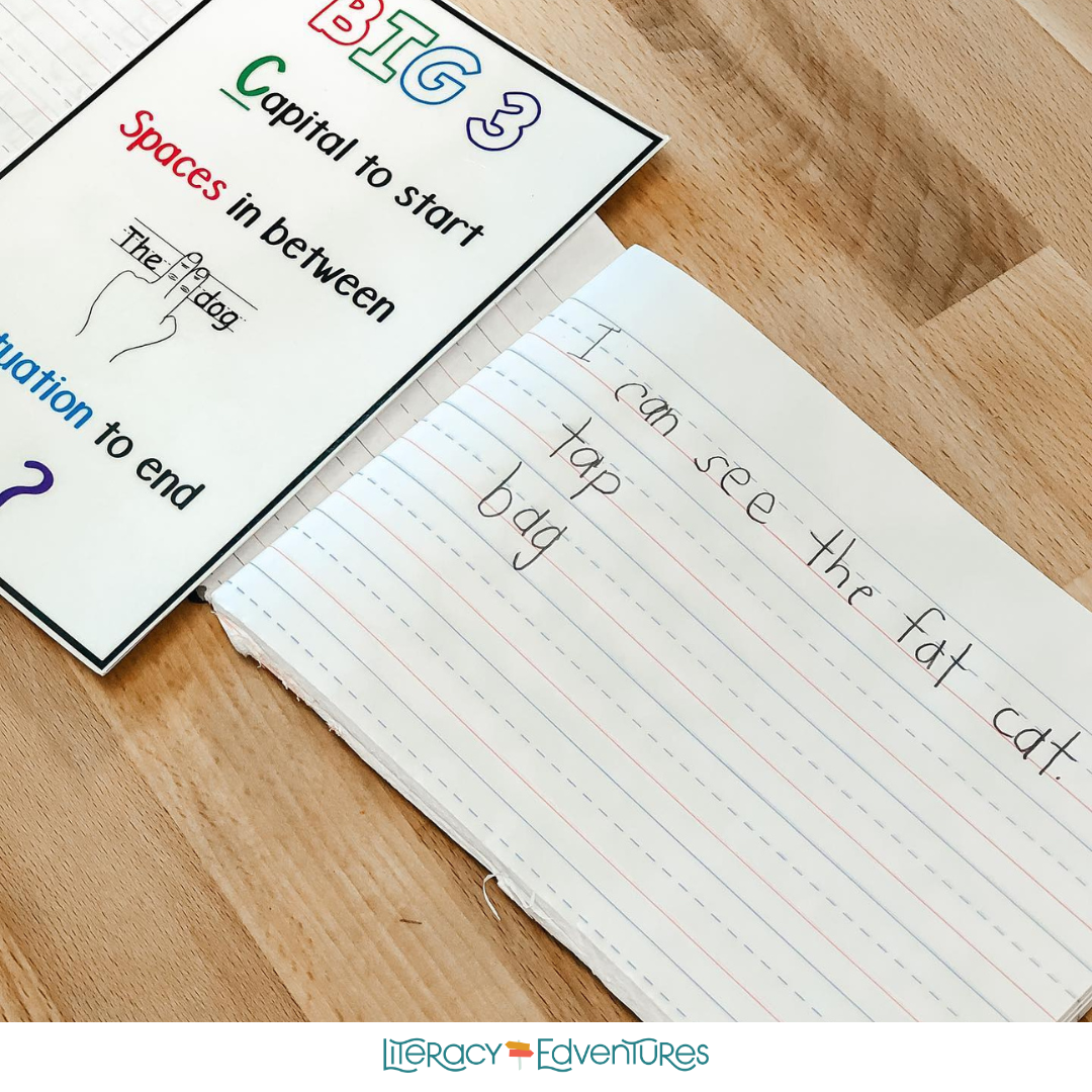Student-written sentence during K–3 dictation practice showing phonics-based spelling and spacing.