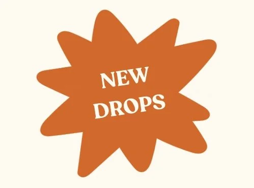 Orange starburst graphic with white text that says 'NEW DROPS'