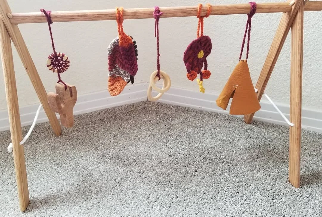 Wooden infant toy. Southeast themed.