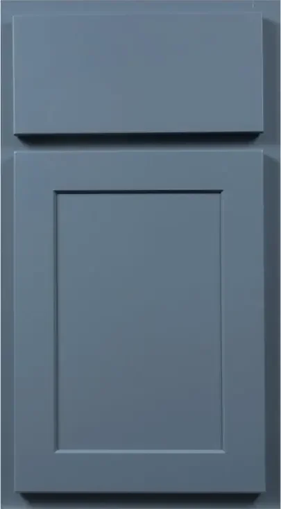 A close-up of a blue cabinet door with a raised panel design.
