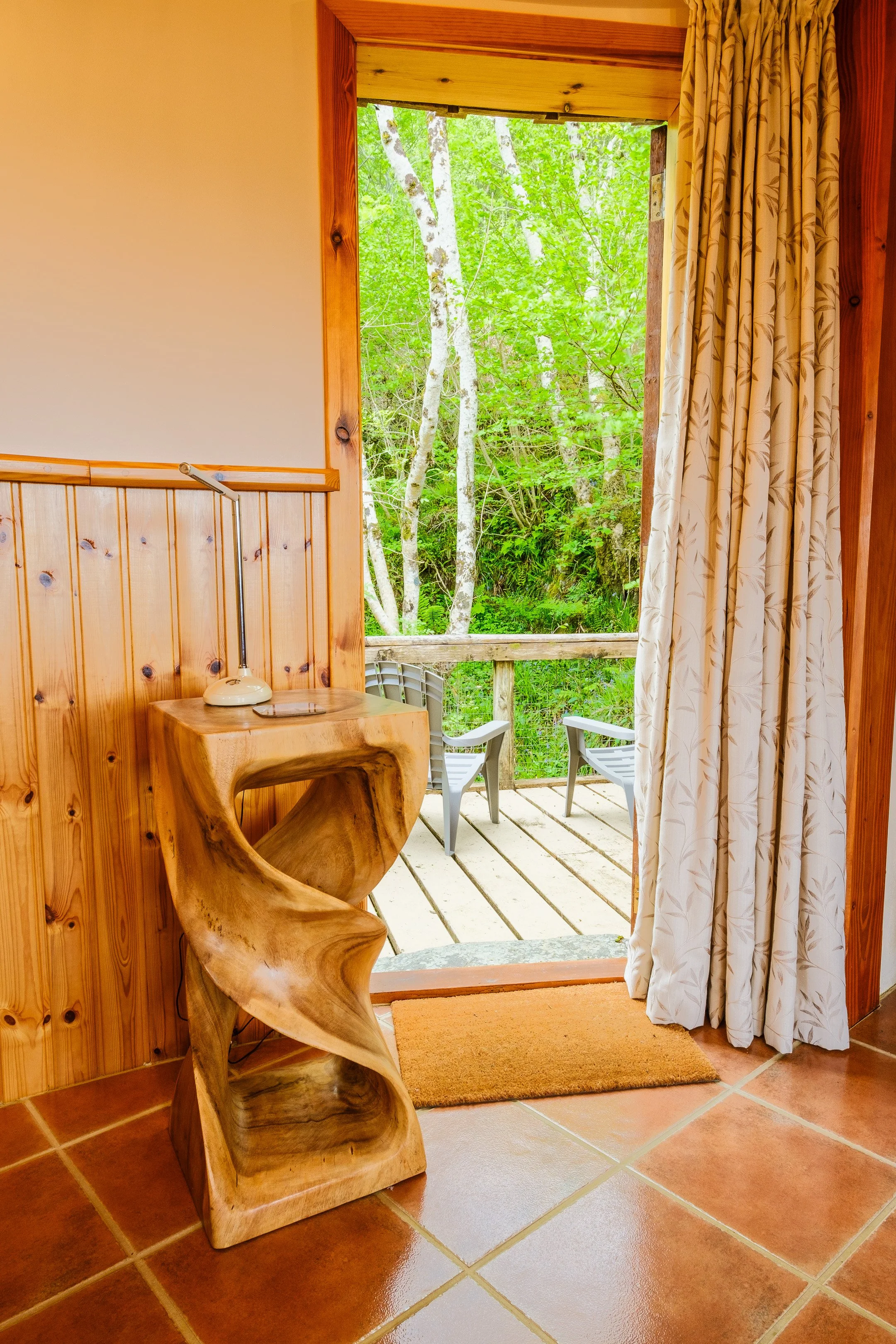 Door onto deck overlooking waterfall Usige Beo Self catering cottage on the shores of Loch sunart,  Ardnamurchan (Copy)