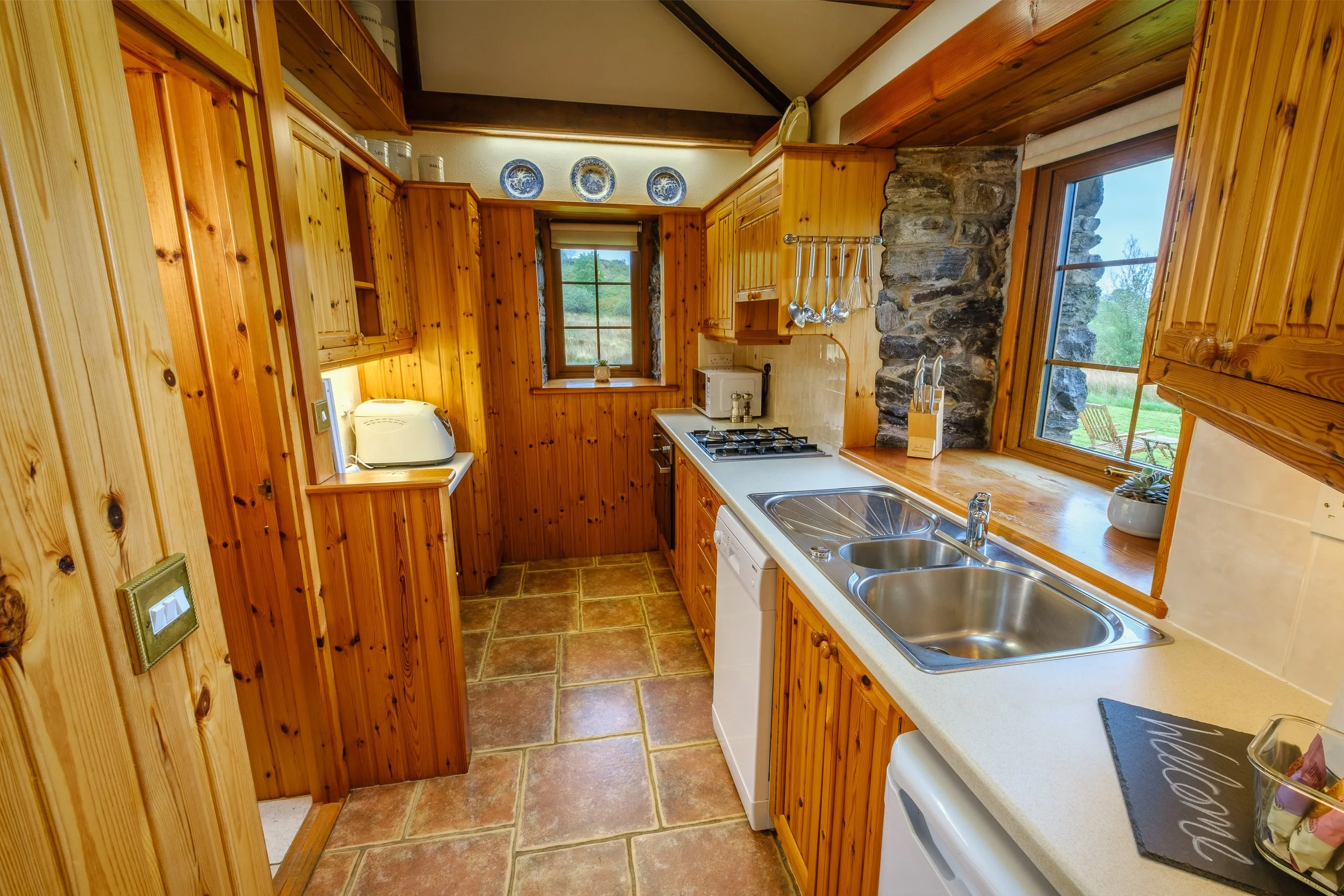 well equipped kitchen and cozy open plan living room with wood burning stove. Camas bàn cottage, self catering cottage for 2 -4 people on the shorefront of Loch Sunart, Ardnamurchan (Copy)