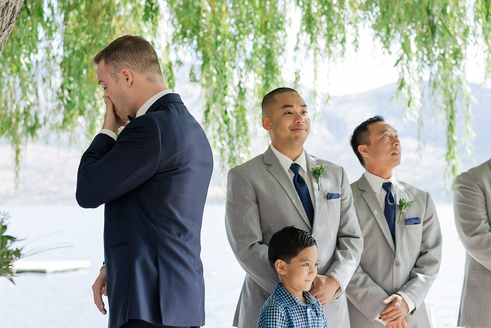 groom crying while he waits to see his bride for the first time