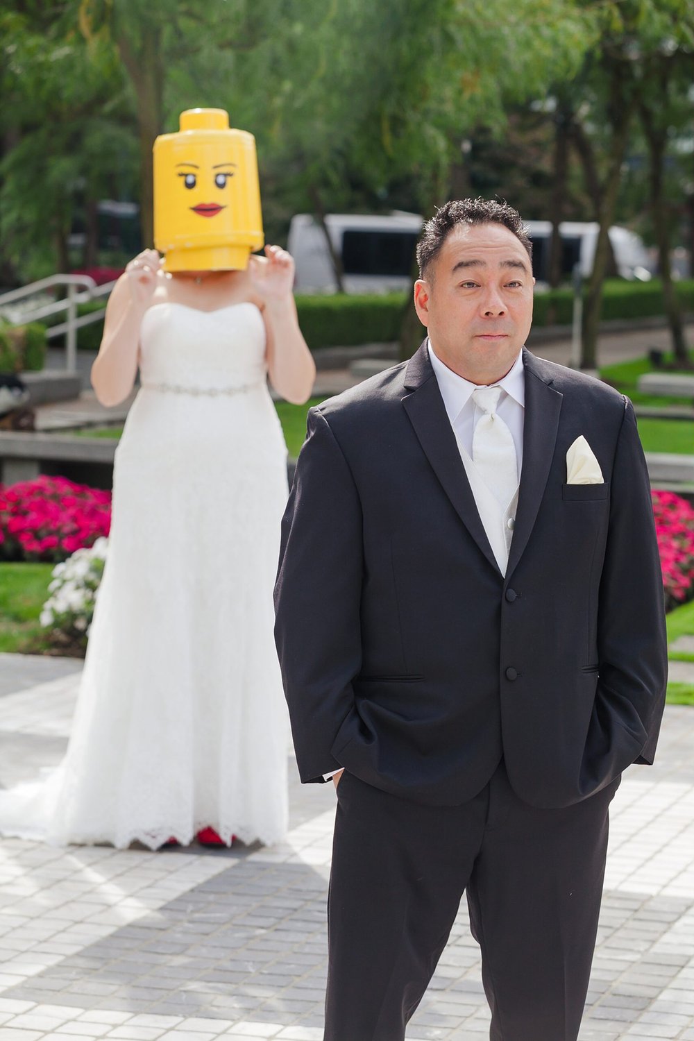 bride surprises groom with a custom lego head during first look