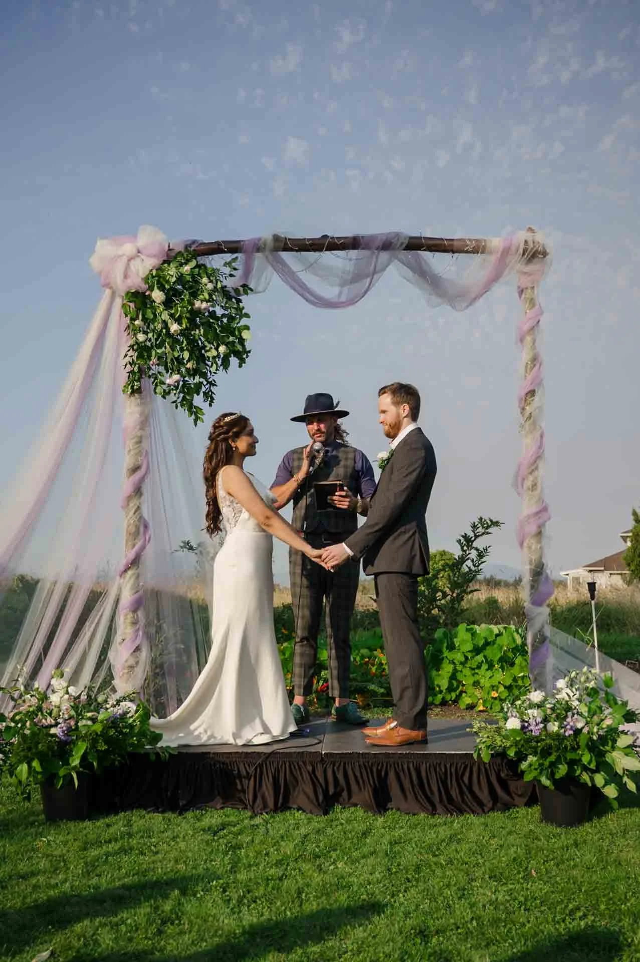 bride and groom being married by a wedding officiant