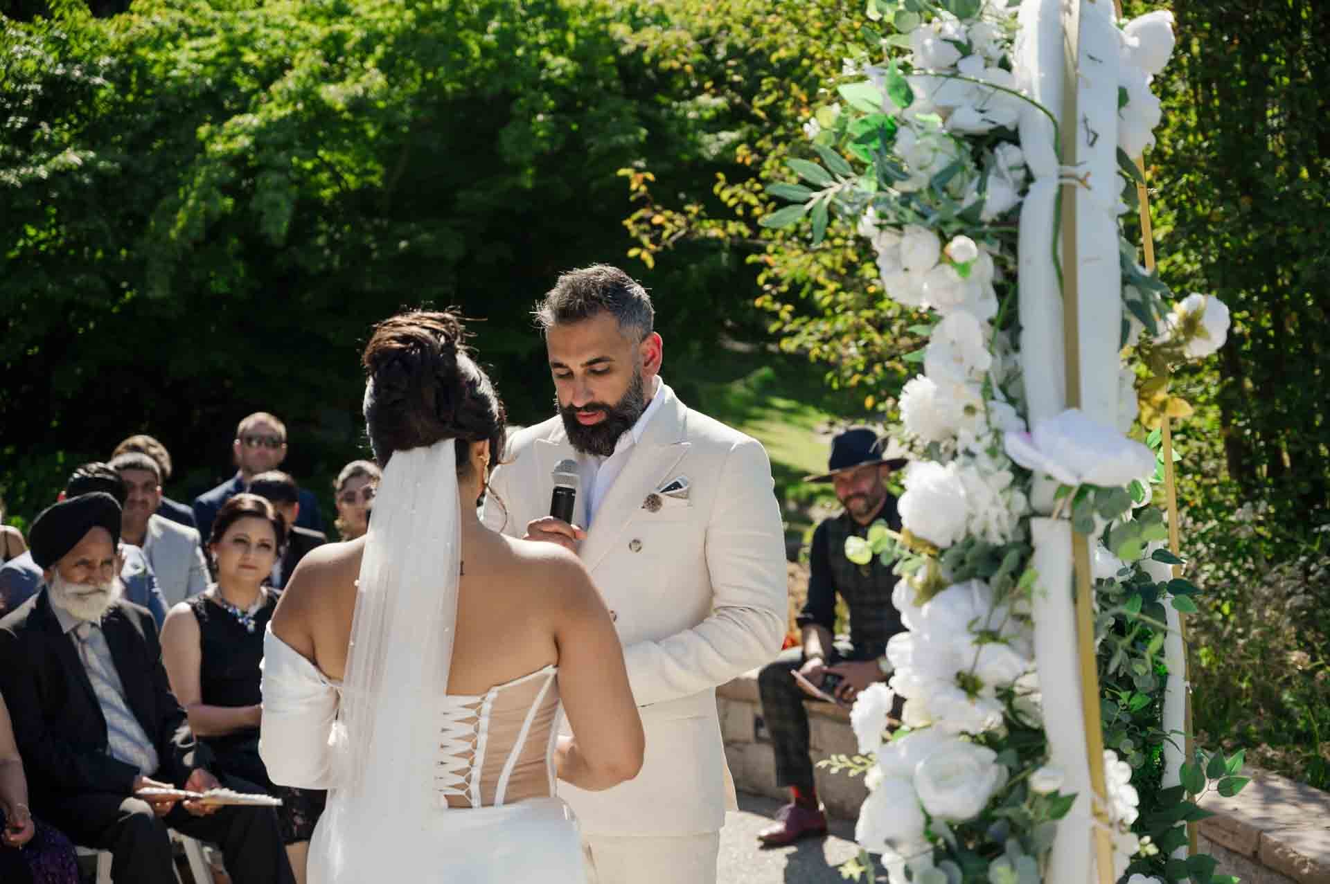 groom saying his vows to bride