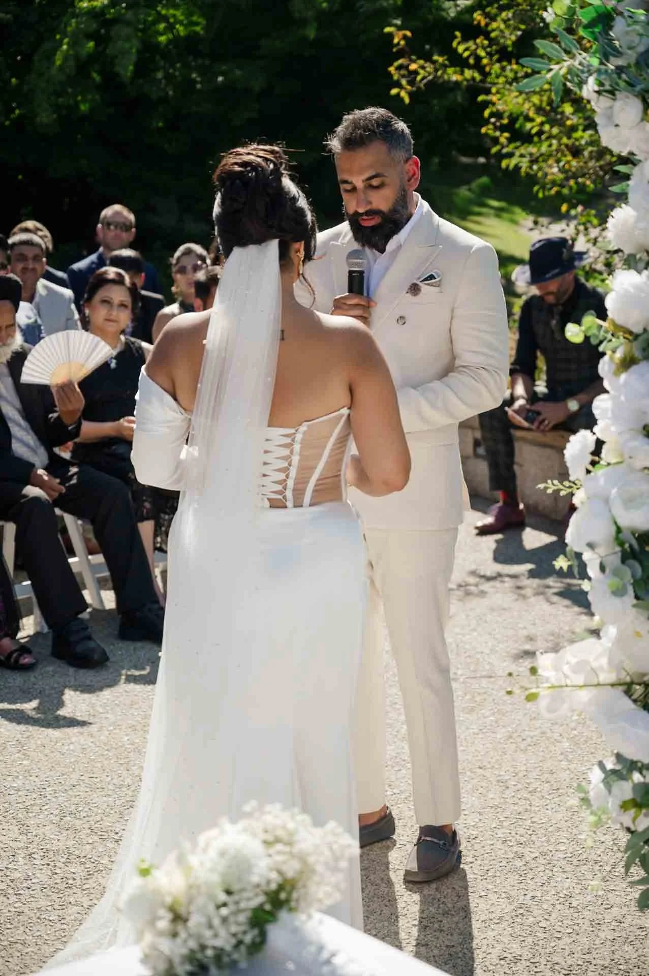 groom saying his vows to bride at outdoor ceremony
