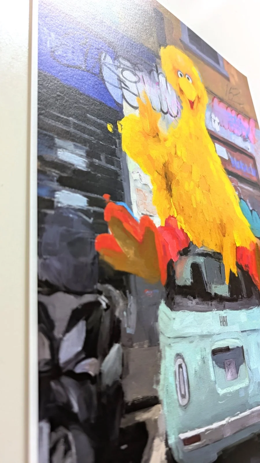 Limited edition art print titled "Bird in Milan" by FunnyTummy, depicting a large Big Bird sitting on a light blue Fiat 500 in a graffiti-covered Milanese street.