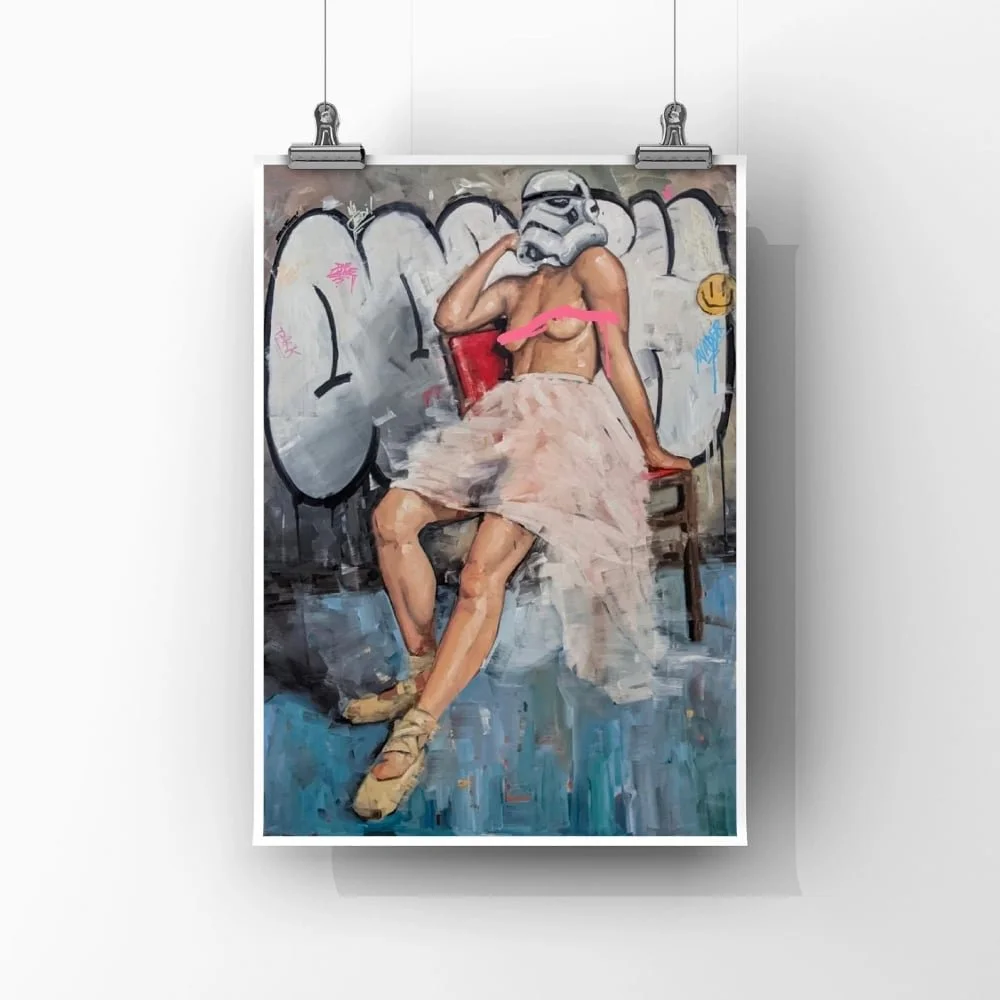 Art print titled "Troops" by FunnyTummy, depicting a figure wearing a Stormtrooper helmet and a ballet skirt, sitting on a red chair against a graffiti-covered wall.