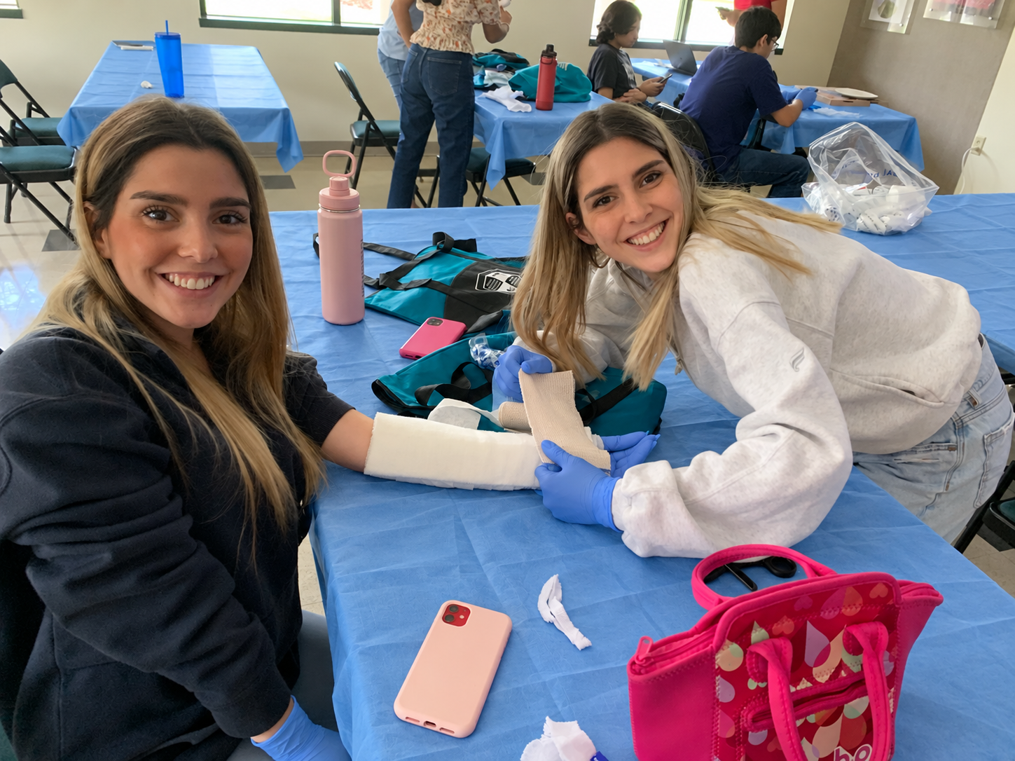 Students Practice Arm Splinting with Blue Drapes-5.png