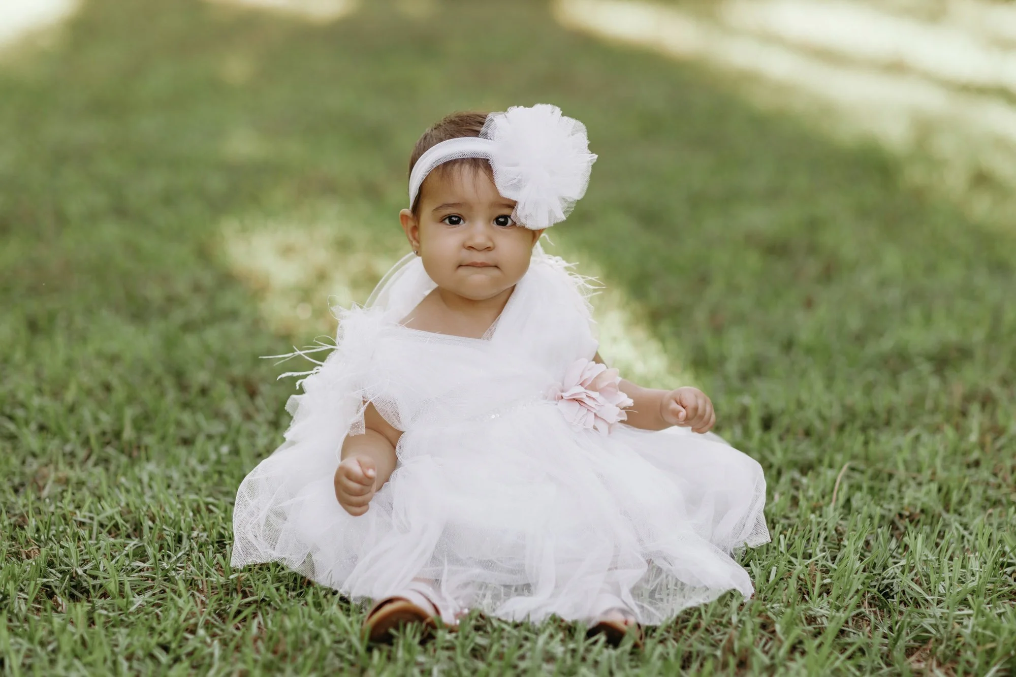 baby photoshoot Nicosia Cyprus toddler sitting on grass in park natural light