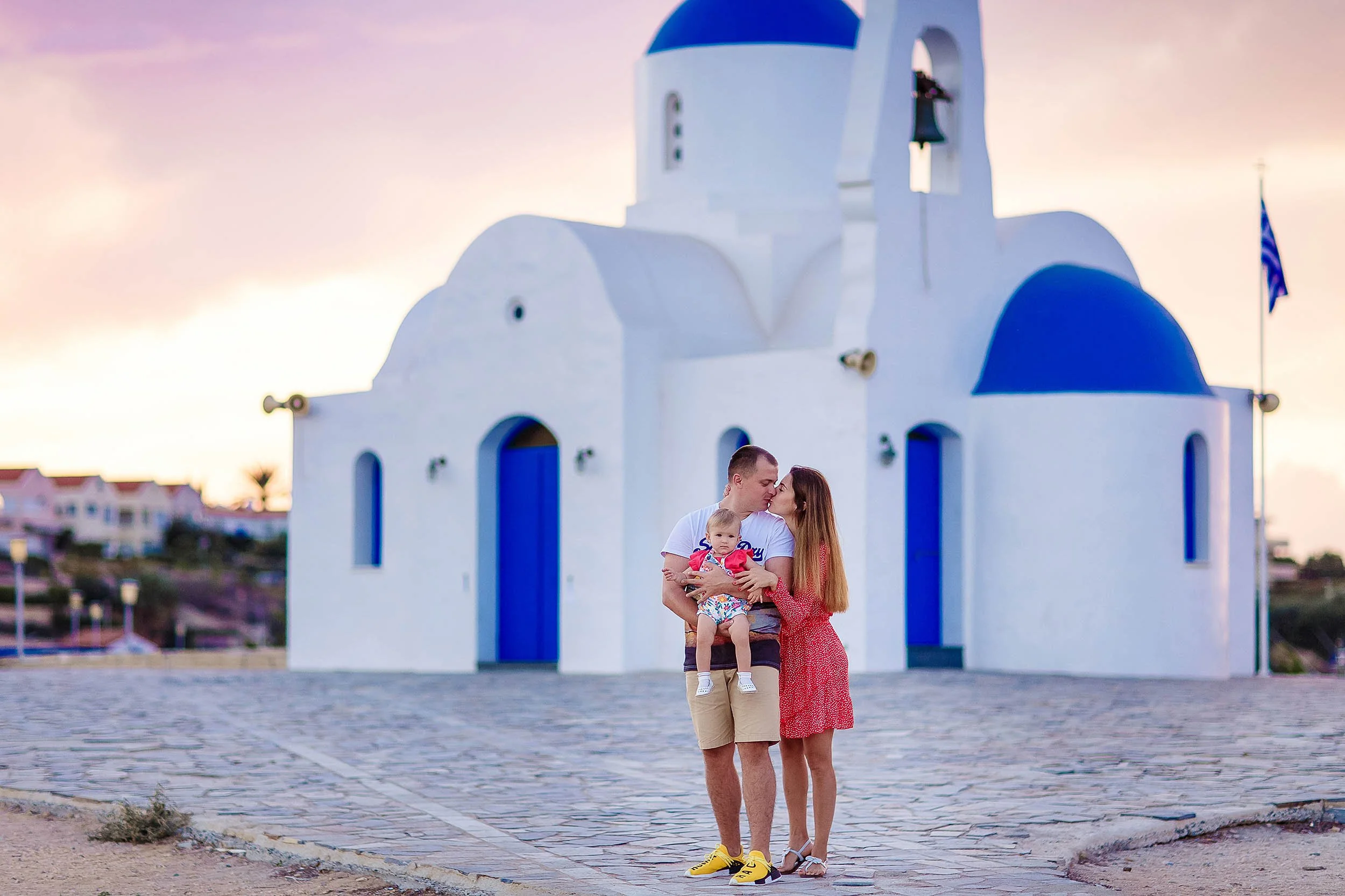 family photoshoot Protaras Cyprus blue and white church background Ayia Napa style architecture