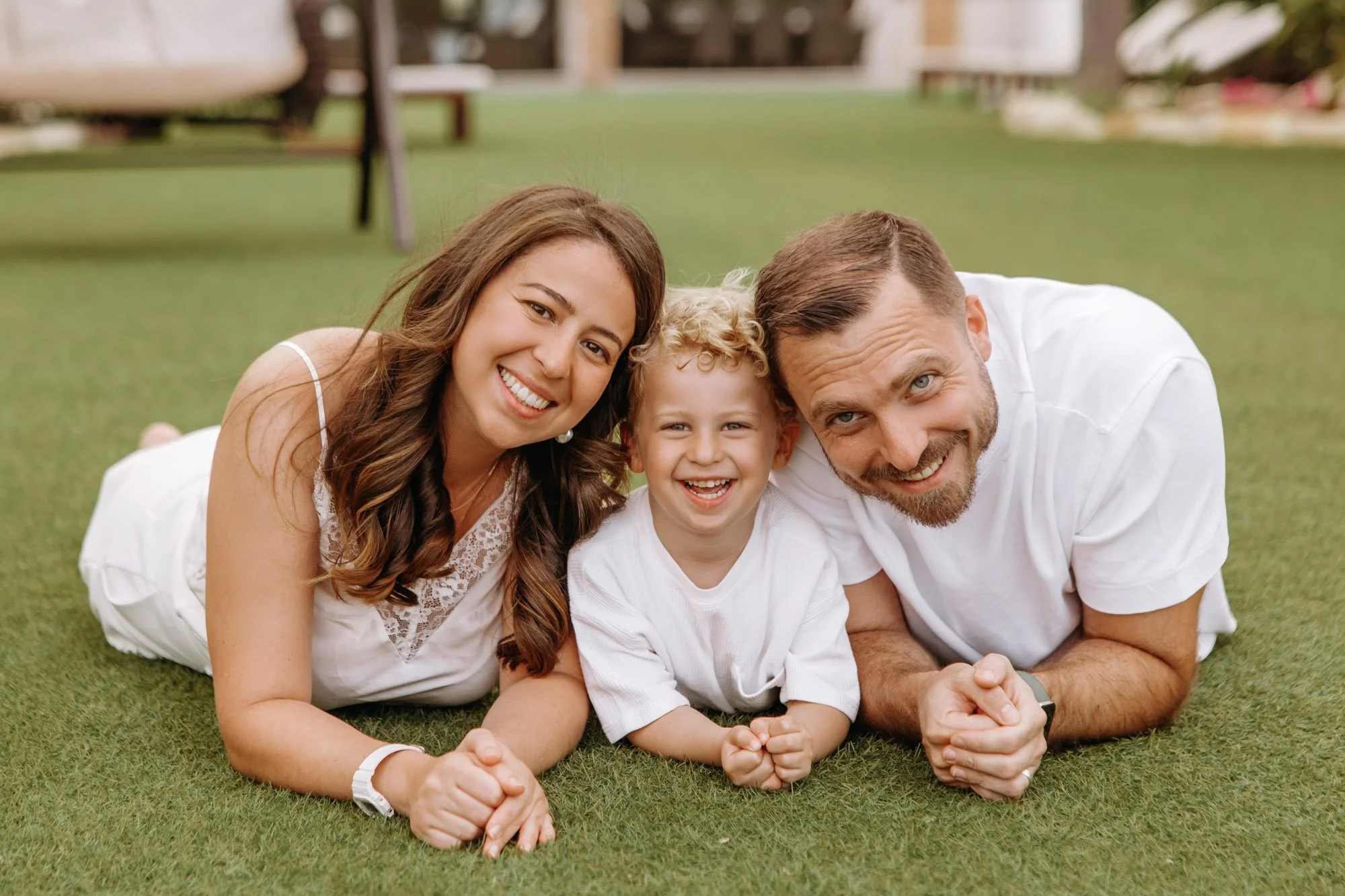 relaxed family portrait Ayia Napa beach smiling parents and child natural light photography