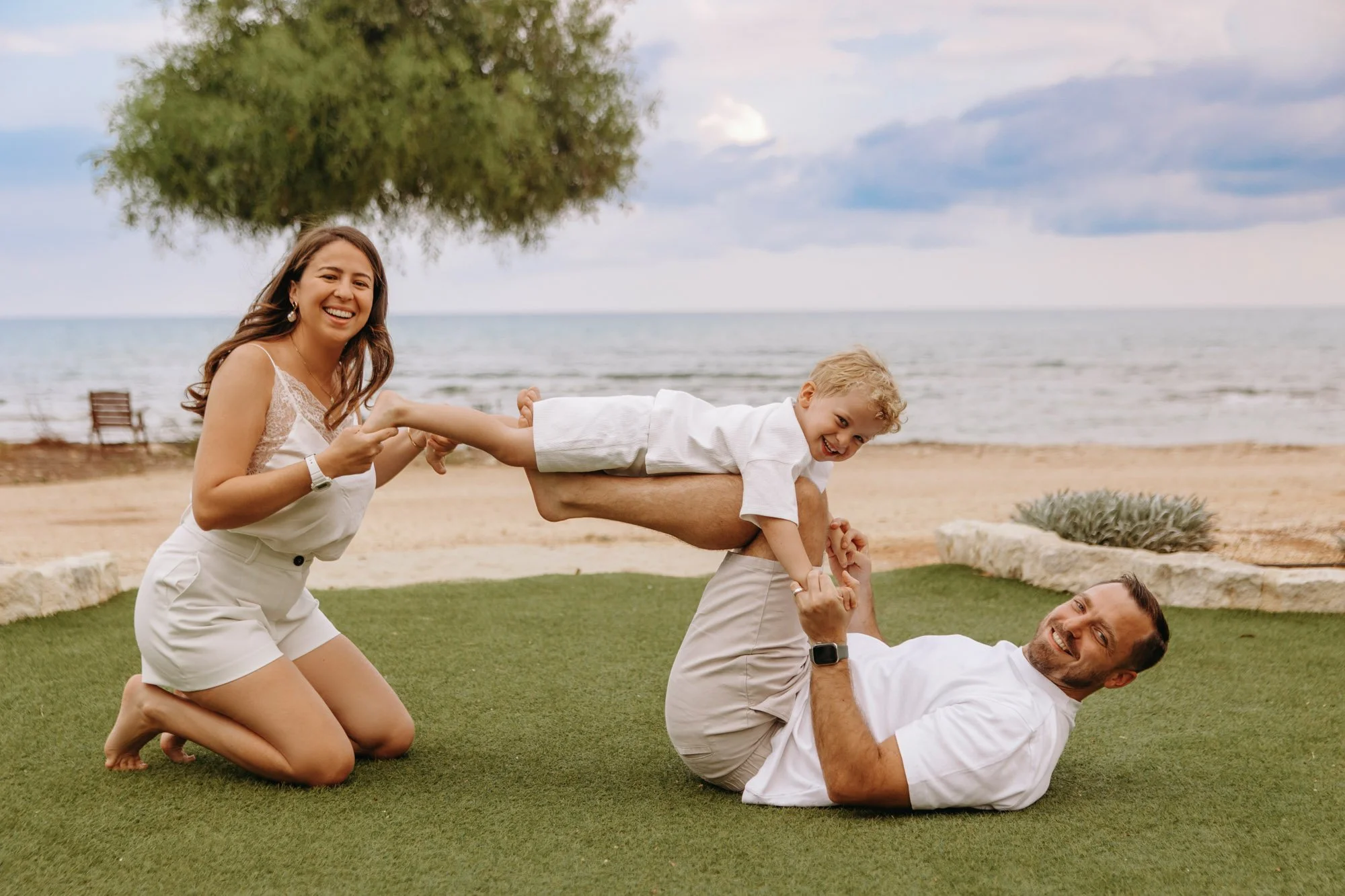 candid family moments Ayia Napa beach natural lifestyle photography with parents and child